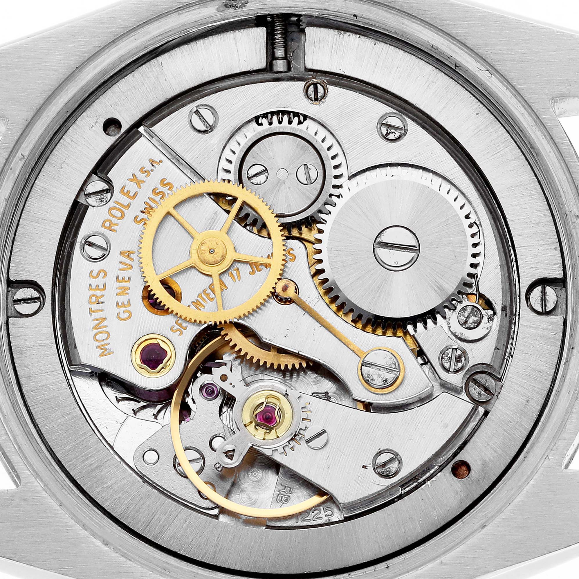 The image shows the movement of a Rolex Date 6694 Men's Stainless Steel Black Dial 6694 Men's Stainless Steel Black Dial watch with visible gears and components from a top-down angle.