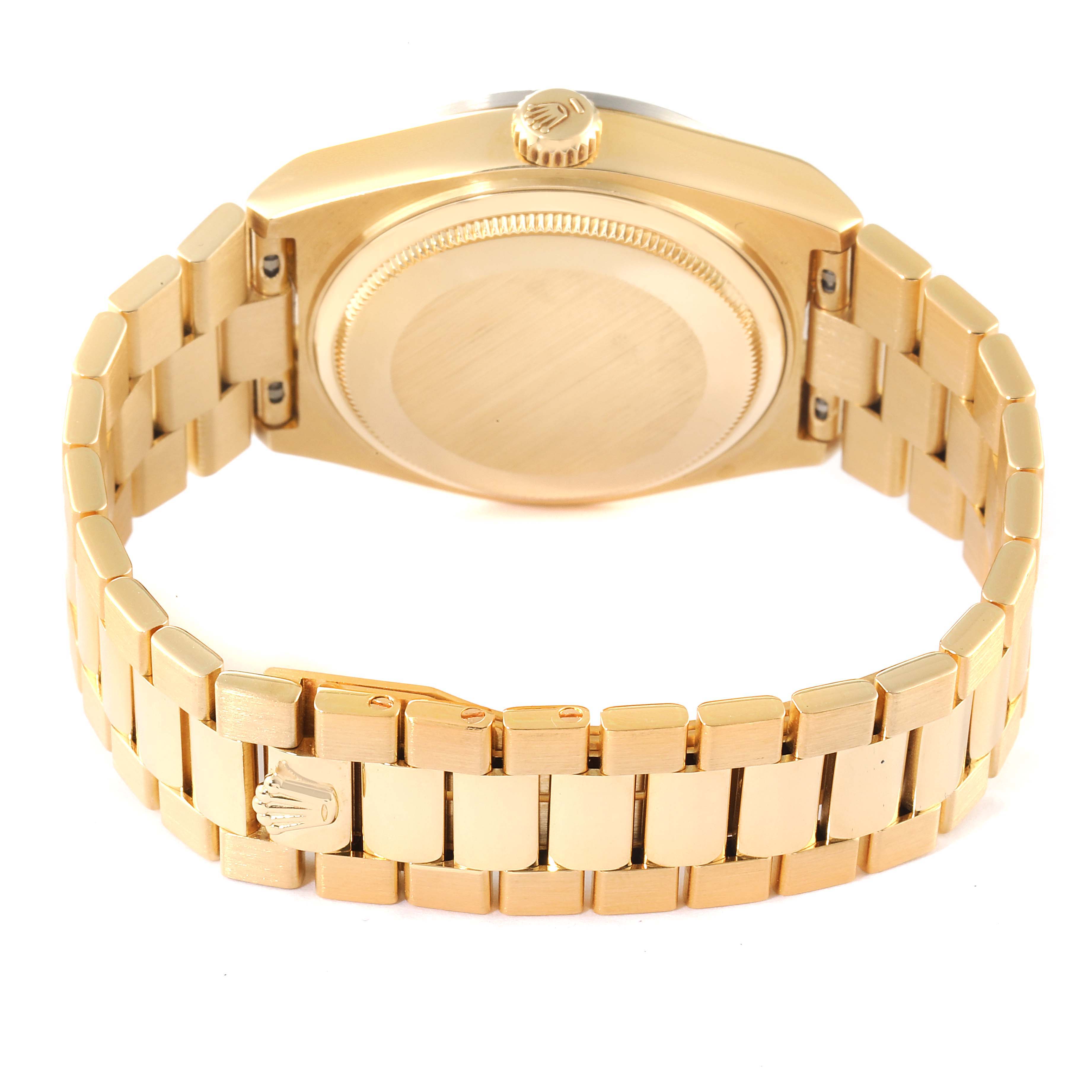 The image shows the back view of a Rolex Oysterquartz watch, highlighting the case back and metal bracelet.