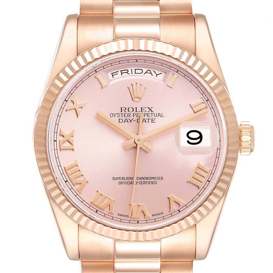 The Rolex President watch is shown from a front angle, displaying its pink dial, Roman numerals, and fluted bezel.