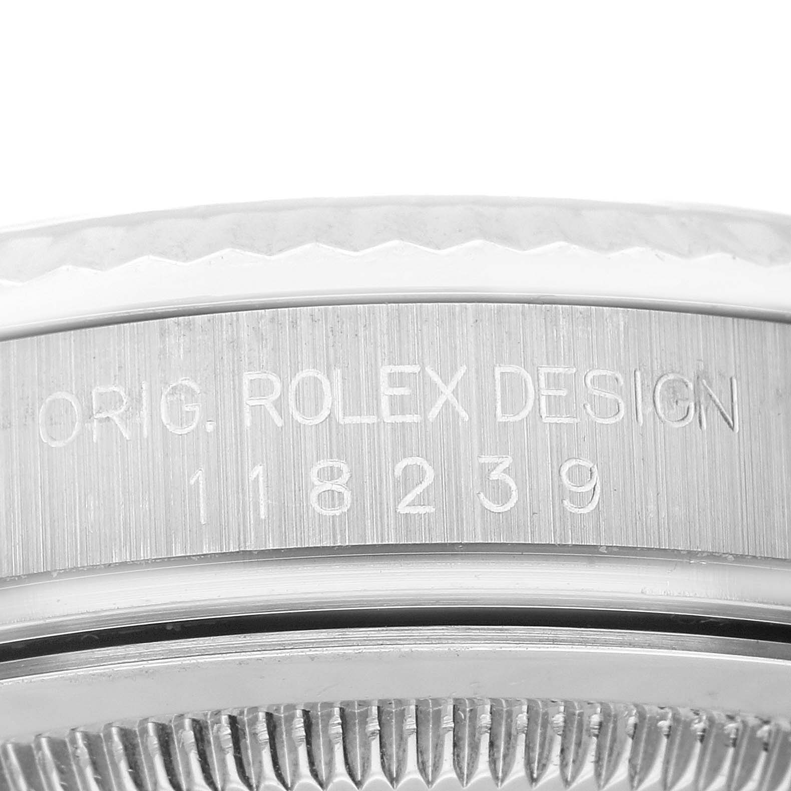 This image shows the side of a Rolex President 118239 Men's White Gold Silver Dial 118239 Men's White Gold Silver Dial model watch case, displaying the engraved serial number and design information.