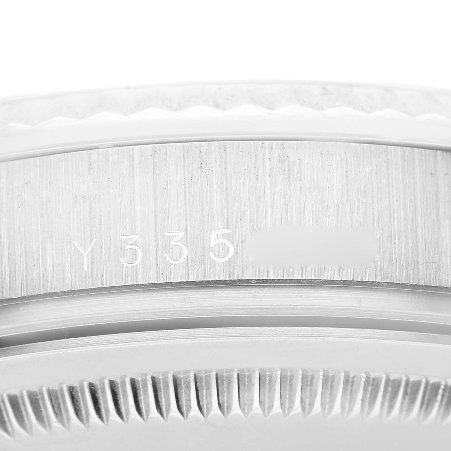 The image shows a close-up of the case and bezel of a Rolex President 118239 Men's White Gold Silver Dial 118239 Men's White Gold Silver Dial model, highlighting the serial number engraving.