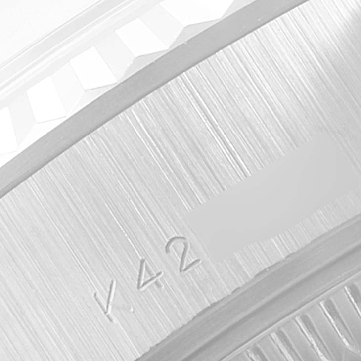 This close-up image shows the engraved reference number and part of the fluted bezel of a Rolex President 79179 Women's White Gold Silver Dial 79179 Women's White Gold Silver Dial model watch.