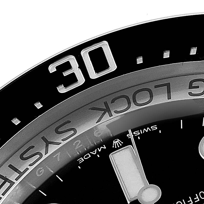 The image shows a close-up angle of the bezel and dial of a Rolex Sea-Dweller 126660 Men
s Stainless Steel Black Dial 126660 Men
s Stainless Steel Black Dial watch.