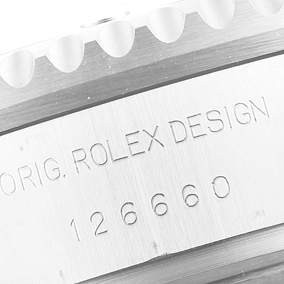 This close-up image shows the side of a Rolex Sea-Dweller 126660 Men
s Stainless Steel Black Dial 126660 Men
s Stainless Steel Black Dial, featuring its engraved model number "126660" and "ROLEX DESIGN".