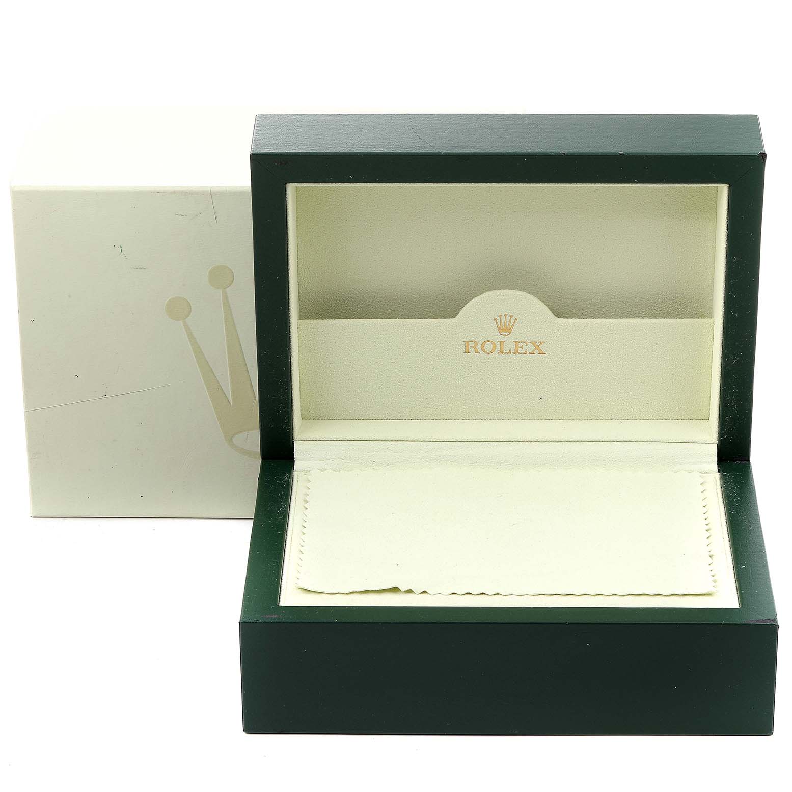 This image shows an open Rolex watch box for the Submariner model, with a cream-colored cloth placed inside and the outer box behind it.