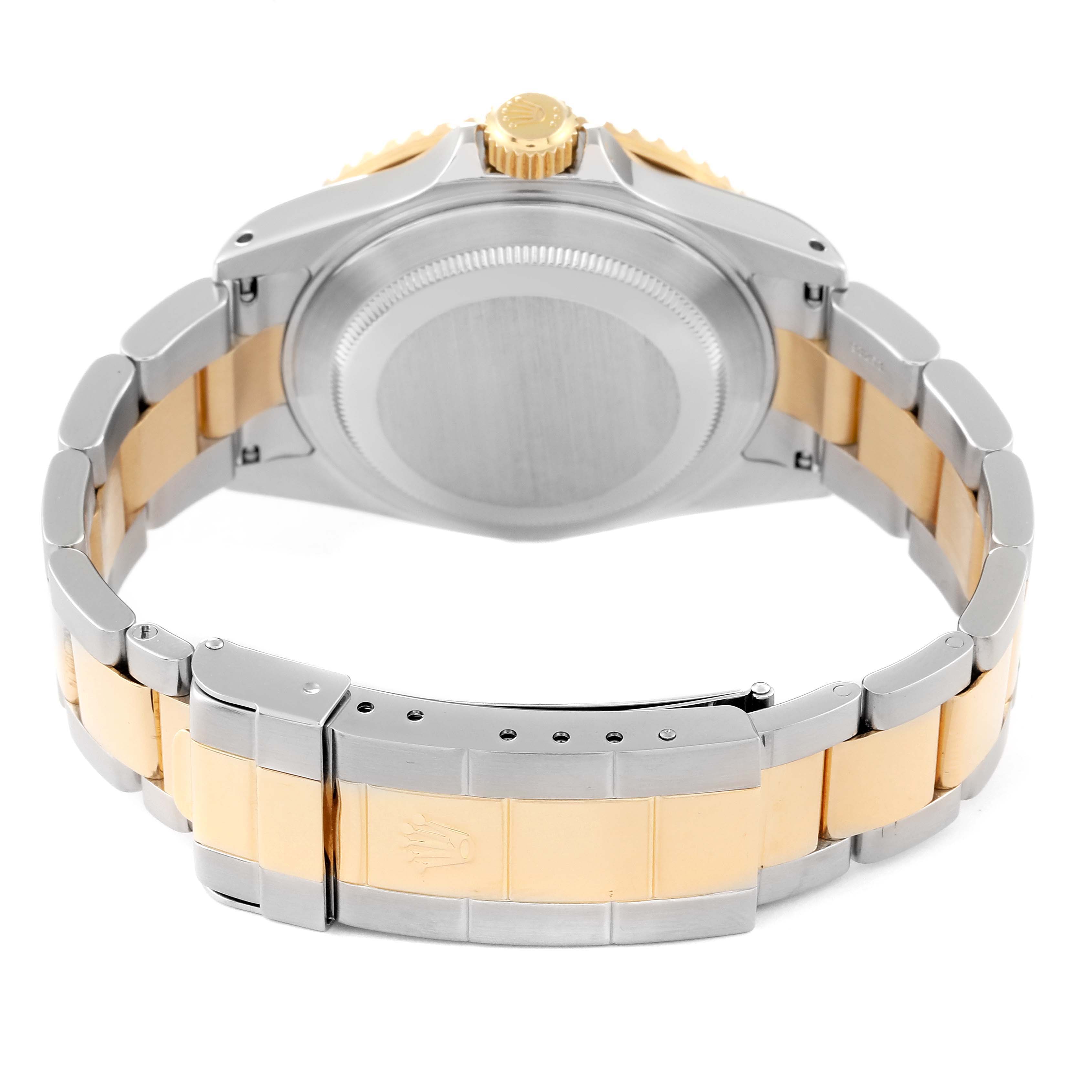 The image shows the back view of a Rolex Submariner 16613 Men's Steel and Gold (two tone) Blue Dial 16613 Men's Steel and Gold (two tone) Blue Dial, highlighting the case back, crown, and two-tone bracelet with the clasp.