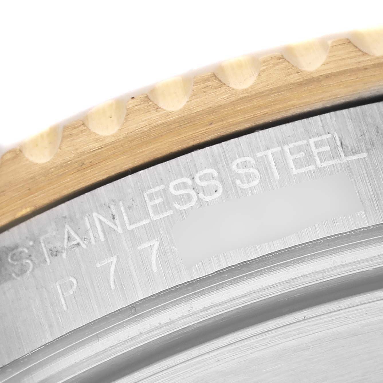 The image shows a close-up of the side engraving on the stainless steel case of a Rolex Submariner 16613 Men's Steel and Gold (two tone) Blue Dial 16613 Men's Steel and Gold (two tone) Blue Dial watch.
