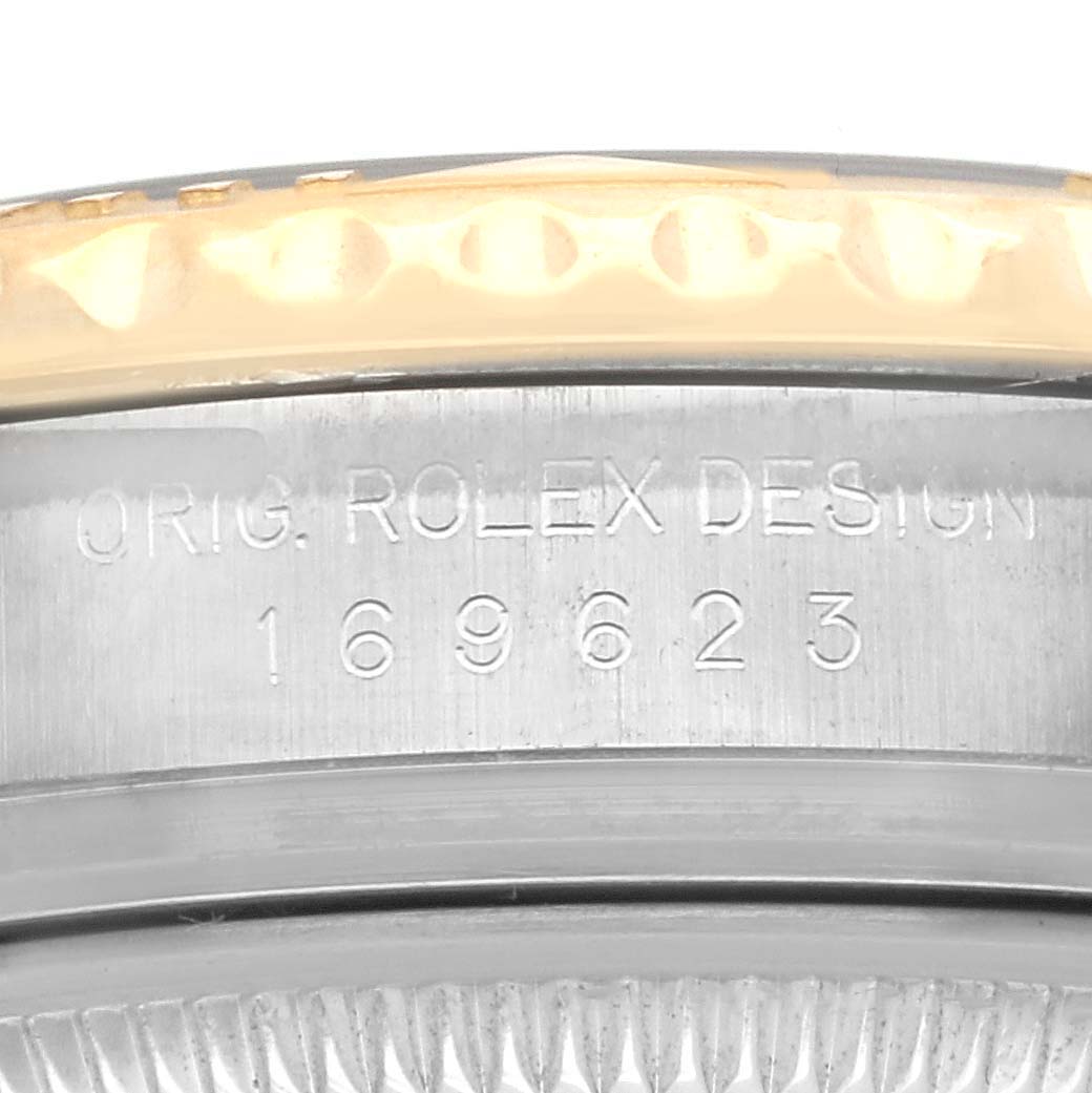 The image shows the side of a Rolex Yacht-Master 169623 Women's Steel and Gold (two tone) White Dial 169623 Women's Steel and Gold (two tone) White Dial watch case with its model number engraved.