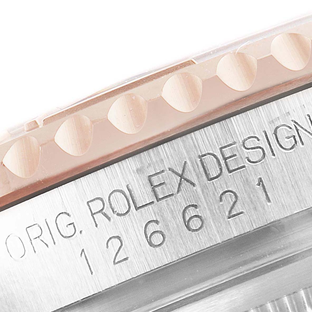 Close-up of the Rolex Yacht-Master 126621 Men
s Steel and Gold (two tone) Black Dial 126621 Men
s Steel and Gold (two tone) Black Dial model showing part of the bezel and case with engraving.