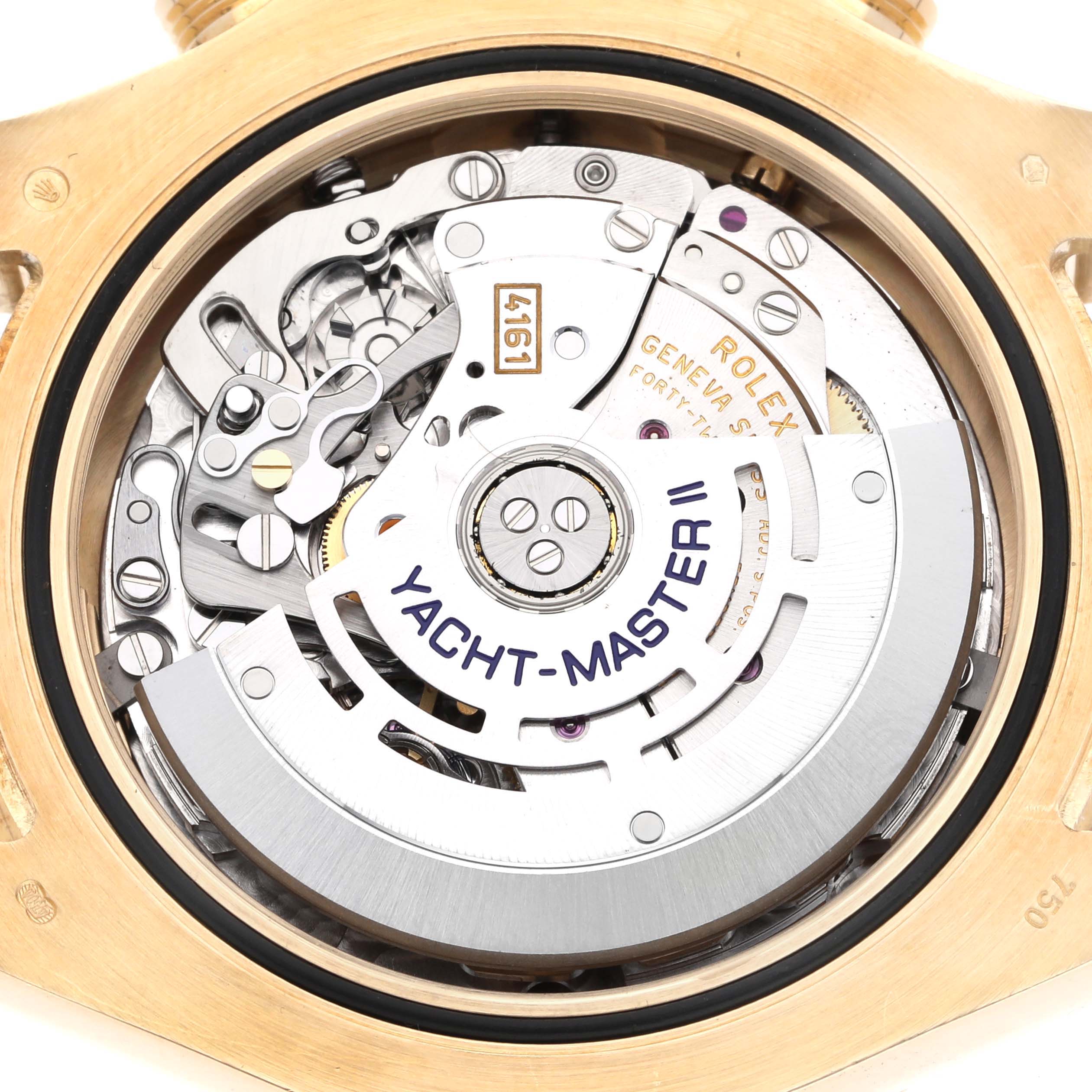 The image shows the back view of a Rolex Yacht-Master 116688 Men's Yellow Gold White Dial 116688 Men's Yellow Gold White Dial watch, highlighting its intricate movement and rotor.