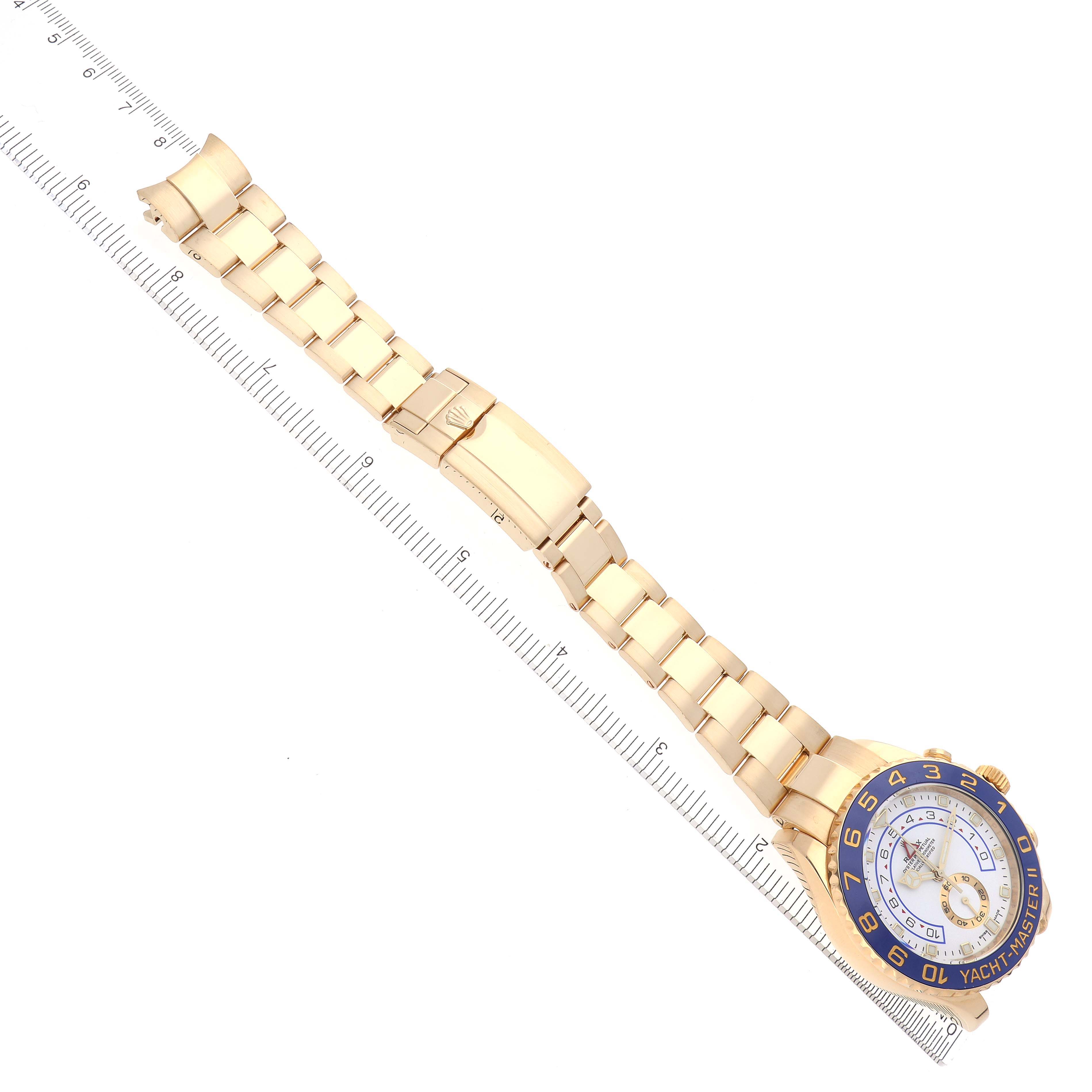 The Rolex Yacht-Master 116688 Men's Yellow Gold White Dial 116688 Men's Yellow Gold White Dial watch is shown from a top-down angle, displaying the entire bracelet, clasp, and watch face.