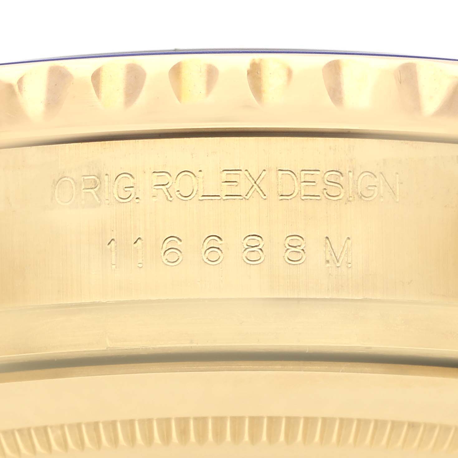 The image shows the side profile of a Rolex Yacht-Master 116688 Men's Yellow Gold White Dial 116688 Men's Yellow Gold White Dial watch, focusing on the engraved reference number.