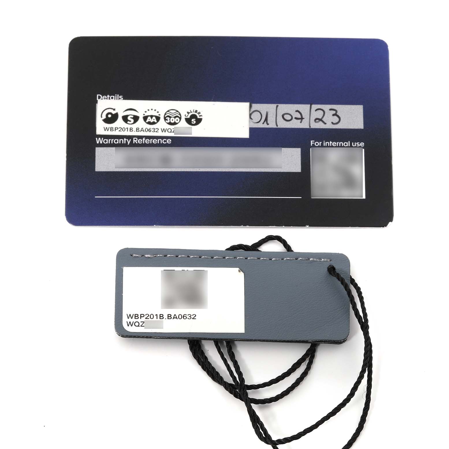 The image shows the warranty card and a tag for the Tag Heuer Aquaracer WBP201B.BA0632 Men's Stainless Steel Blue Dial WBP201B.BA0632 Men's Stainless Steel Blue Dial model WBP201B.BA0632.