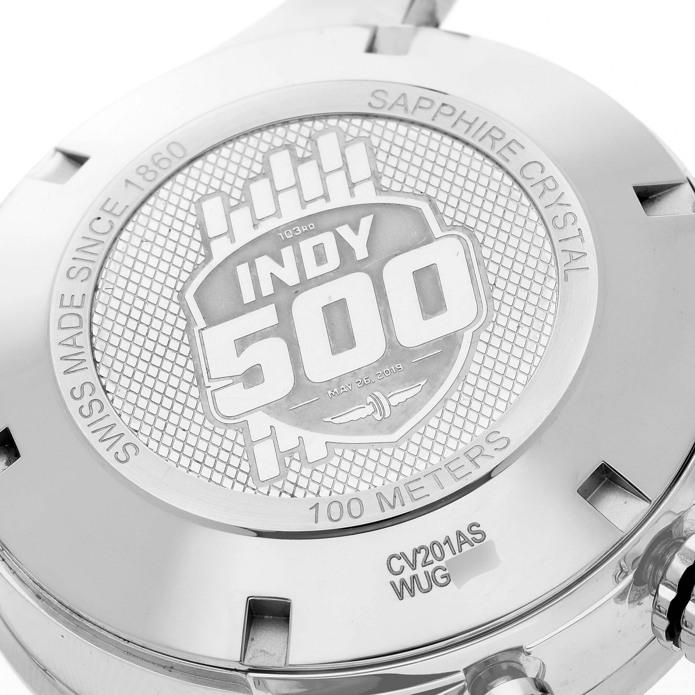 The image shows the case back of a Tag Heuer Carrera CV201AS.FC6429 Men
s Stainless Steel Black Dial CV201AS.FC6429 Men
s Stainless Steel Black Dial watch featuring the "Indy 500" engraving.