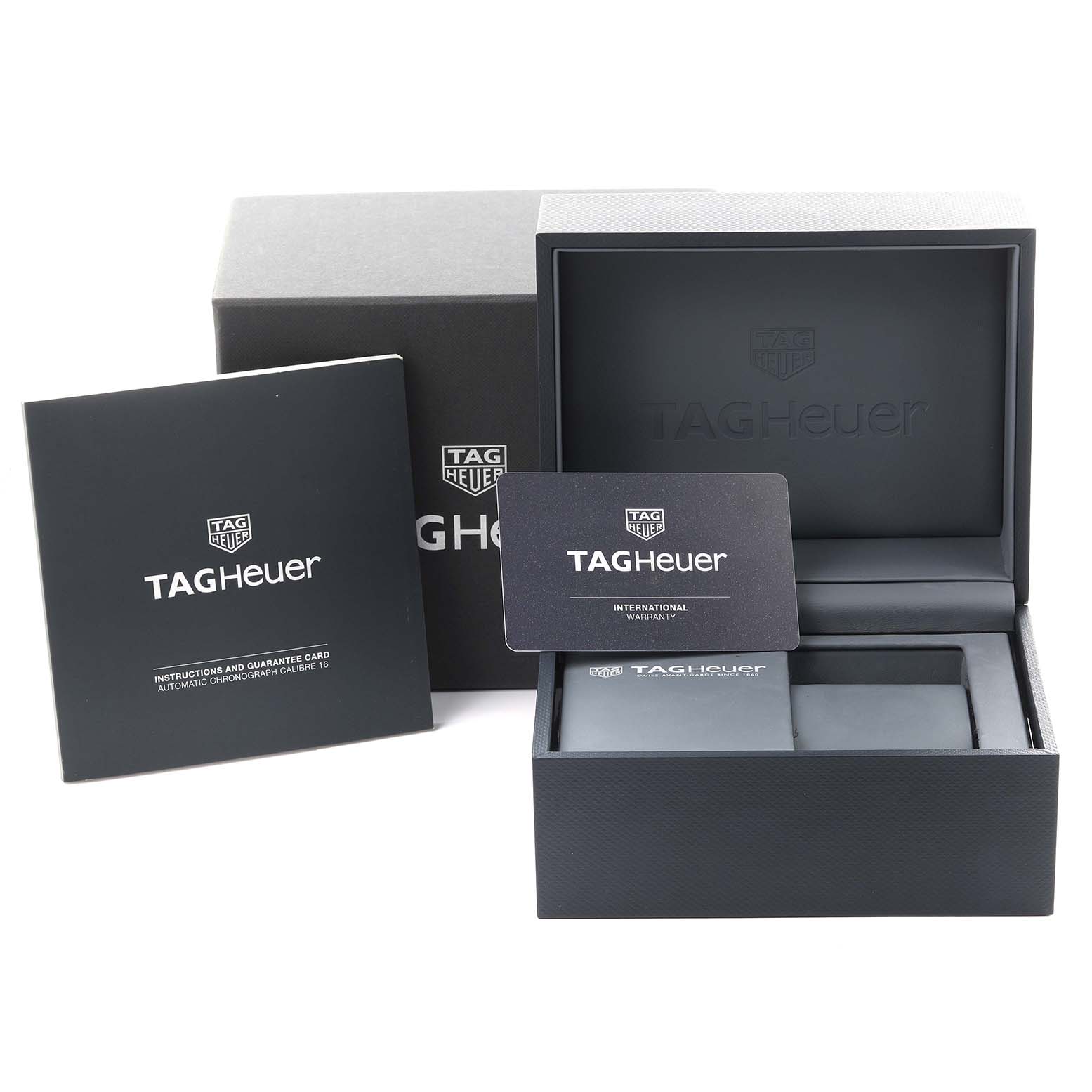 The image shows the packaging and accessories for a Tag Heuer Carrera CV201AS.FC6429 Men
s Stainless Steel Black Dial CV201AS.FC6429 Men
s Stainless Steel Black Dial watch, including the box and guarantee card.