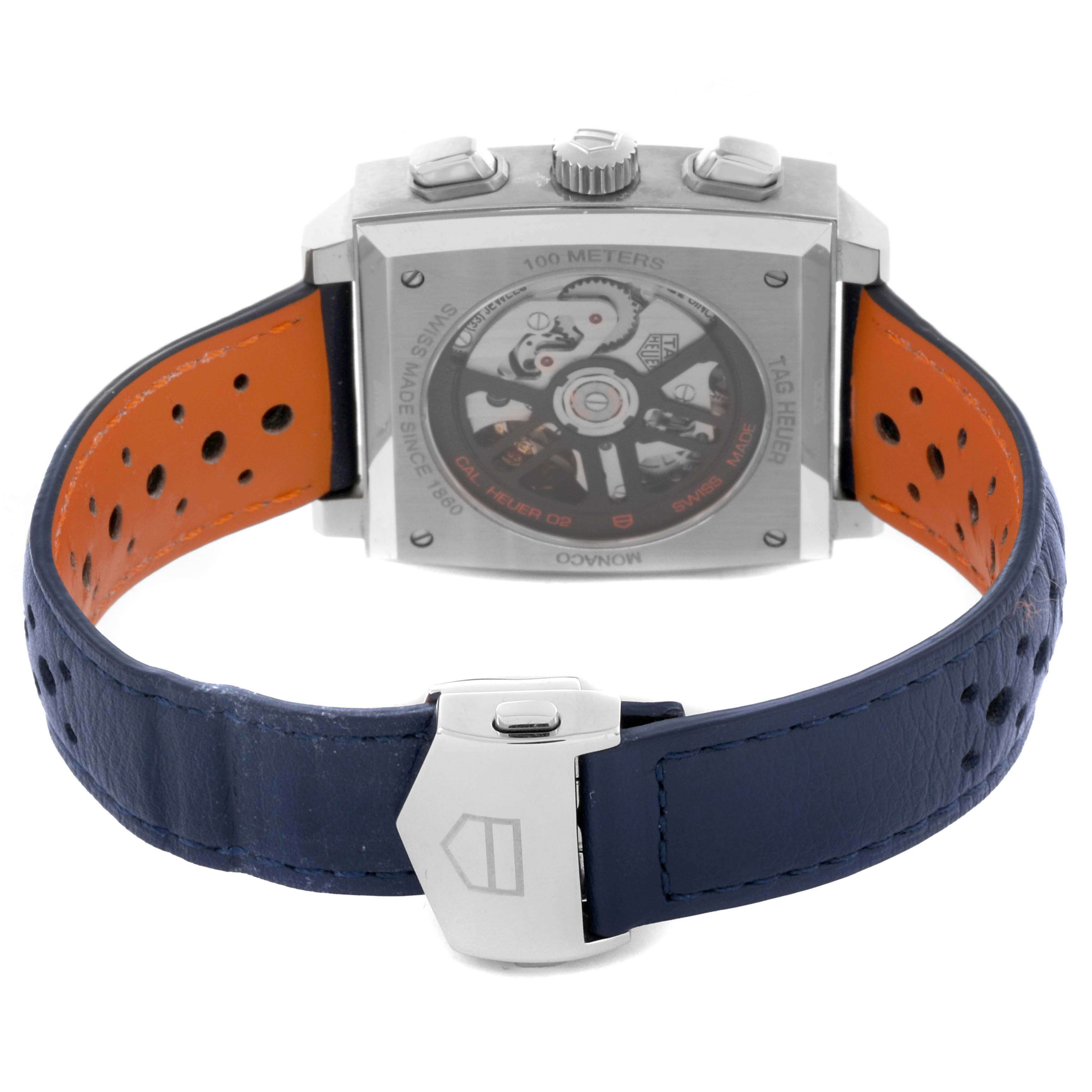 The image shows the back view of a Tag Heuer Monaco CBL2115.FC6494 Men's Stainless Steel Blue Dial CBL2115.FC6494 Men's Stainless Steel Blue Dial watch, highlighting the exposed movement and blue leather strap.