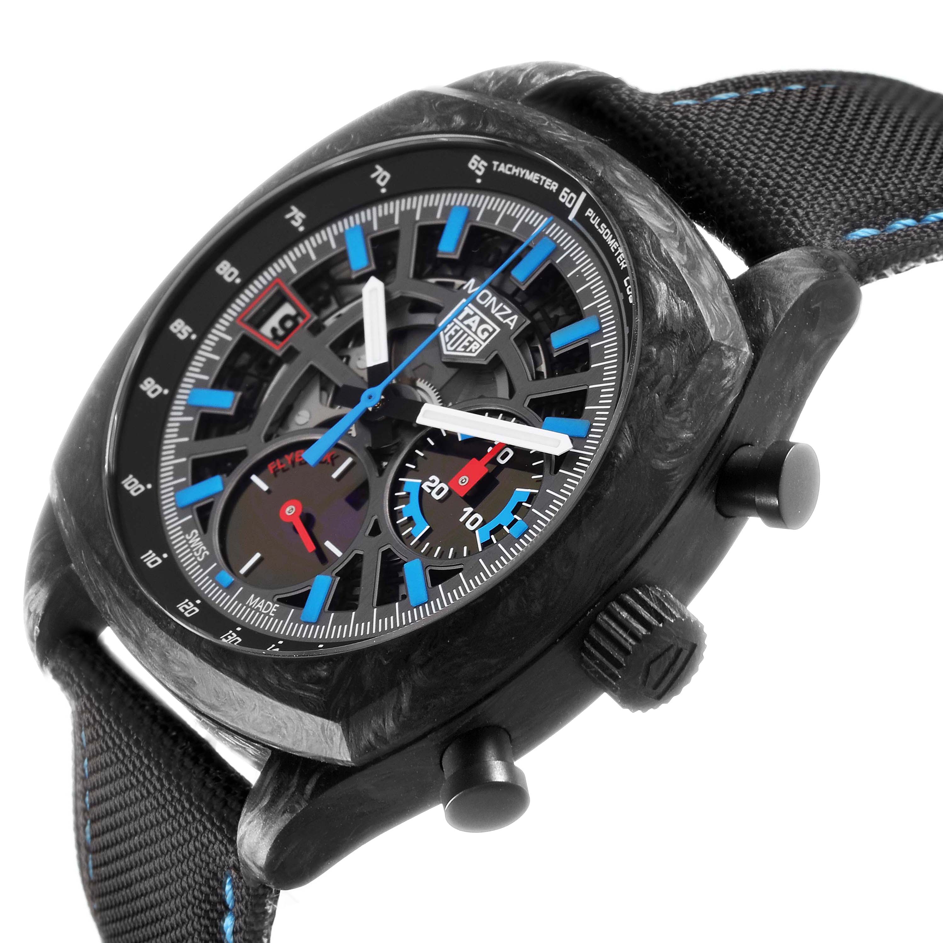 The TAG Heuer Monza watch is shown at an angle displaying the face, side buttons, and strap, highlighting its detailing.