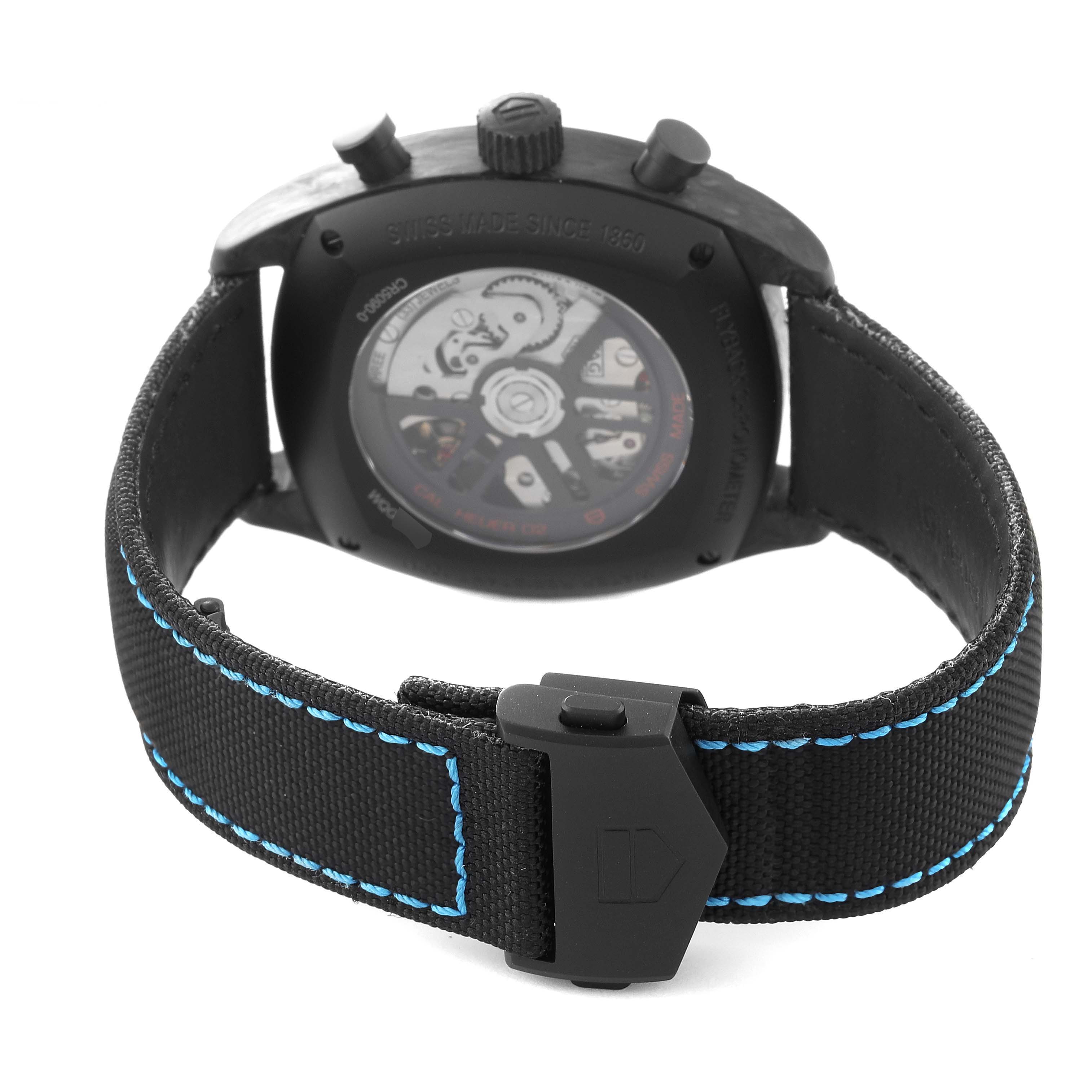 The image shows the rear view of the Tag Heuer Monza CR5090.FN6001 Men
s Titanium Grey Dial CR5090.FN6001 Men
s Titanium Grey Dial watch, highlighting its strap, clasp, and exhibition case back.