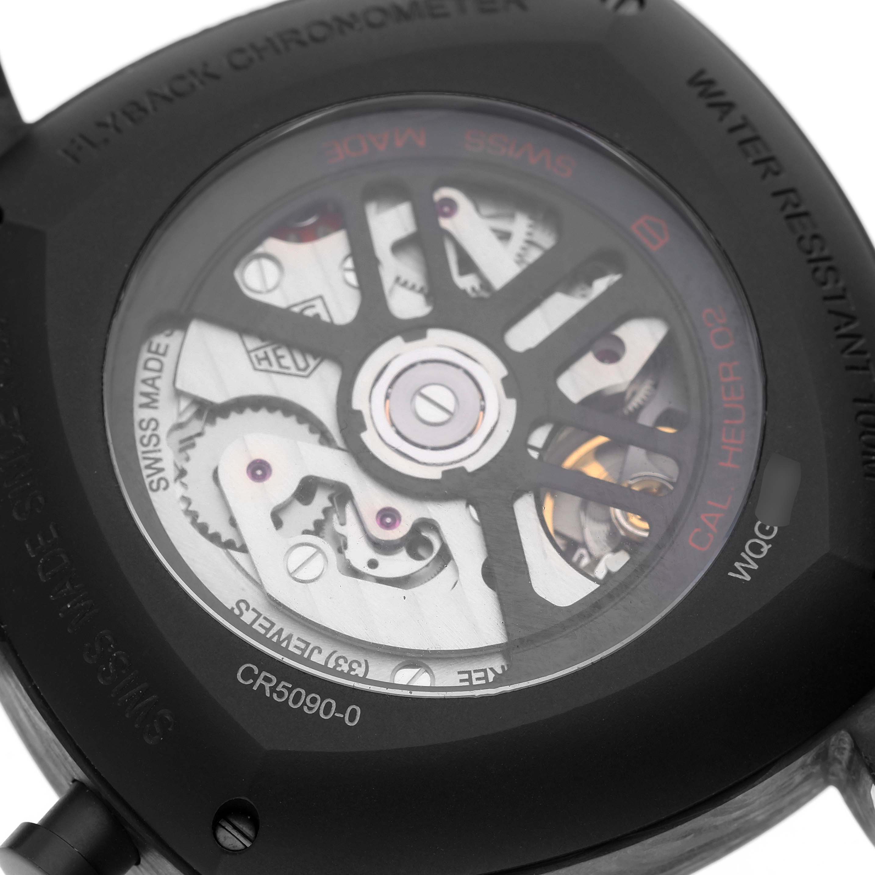 The image shows the back of a Tag Heuer Monza CR5090.FN6001 Men
s Titanium Grey Dial CR5090.FN6001 Men
s Titanium Grey Dial watch, revealing its intricate movement and internal components.