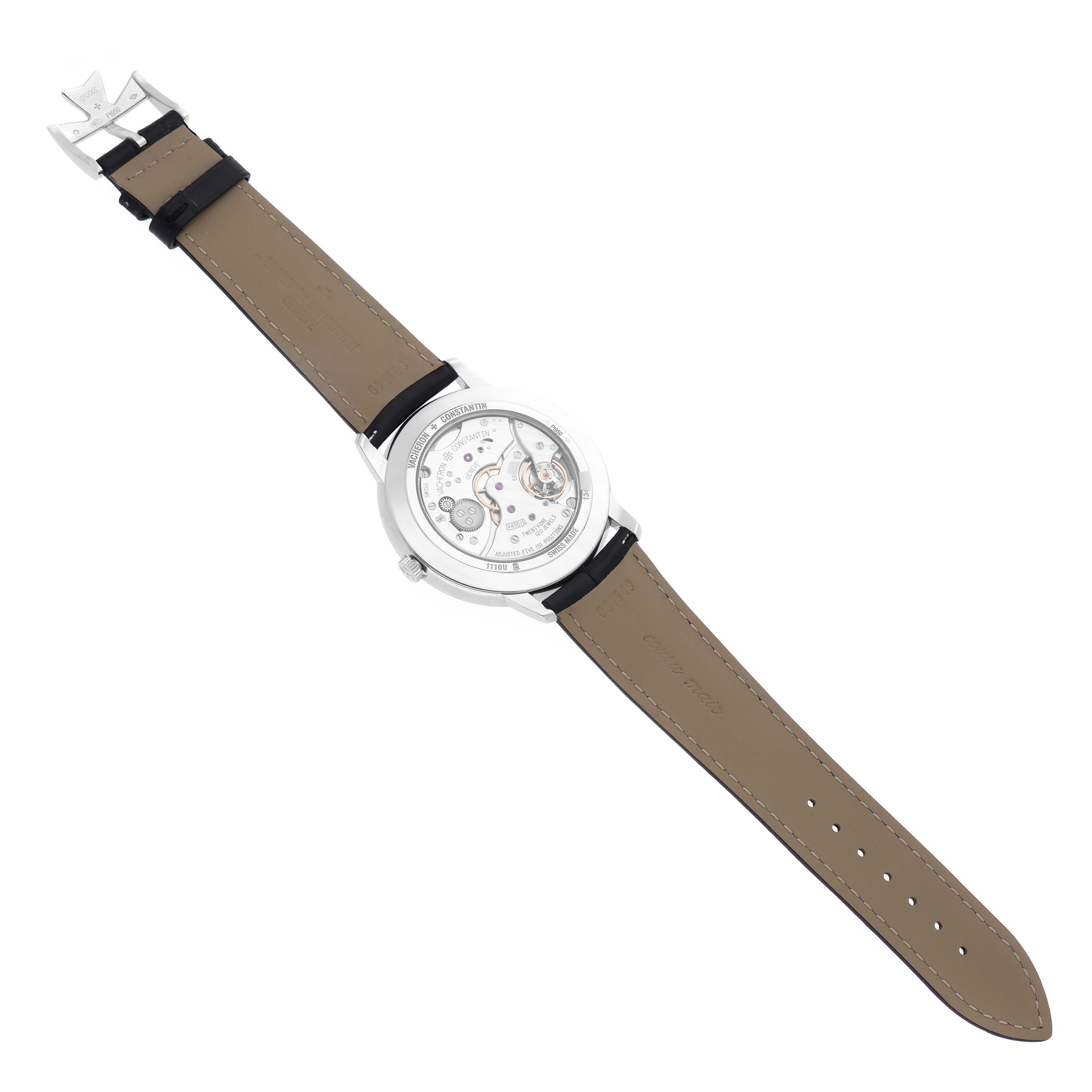 The watch is shown from the back, displaying the movement of the Vacheron Constantin Patrimony 1110U/000P-B087 Men's Platinum Grey Dial 1110U/000P-B087 Men's Platinum Grey Dial model with a brown strap and buckle.