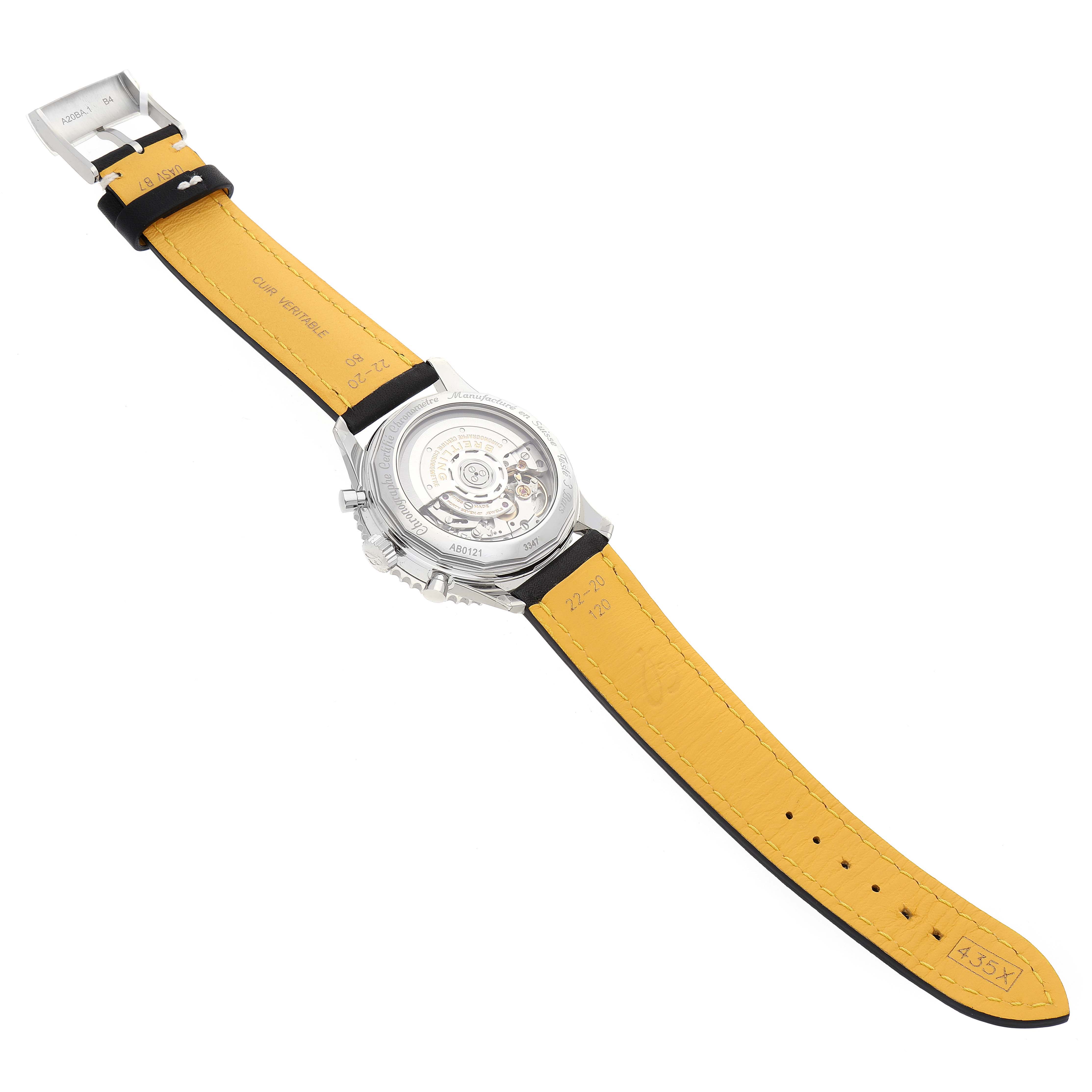 The image shows the case back and the inner mechanism of a Breitling Navitimer AB0121 Men's Stainless Steel Black Dial AB0121 Men's Stainless Steel Black Dial watch with a yellow leather strap.