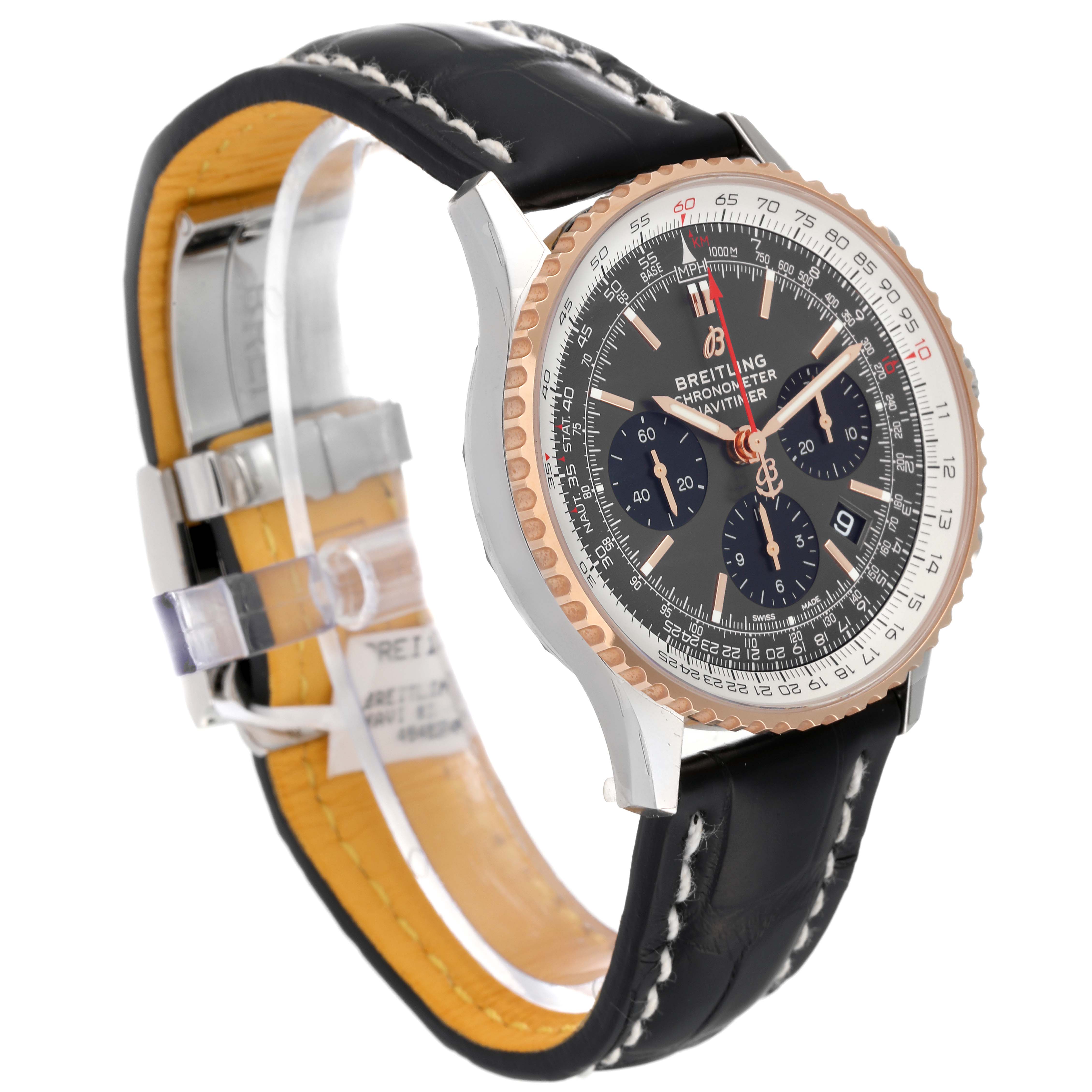 The image shows a Breitling Navitimer UB0121 Men's Steel and Gold (two tone) Grey Dial UB0121 Men's Steel and Gold (two tone) Grey Dial watch at an angle highlighting its face, side, and leather strap with metallic clasp.