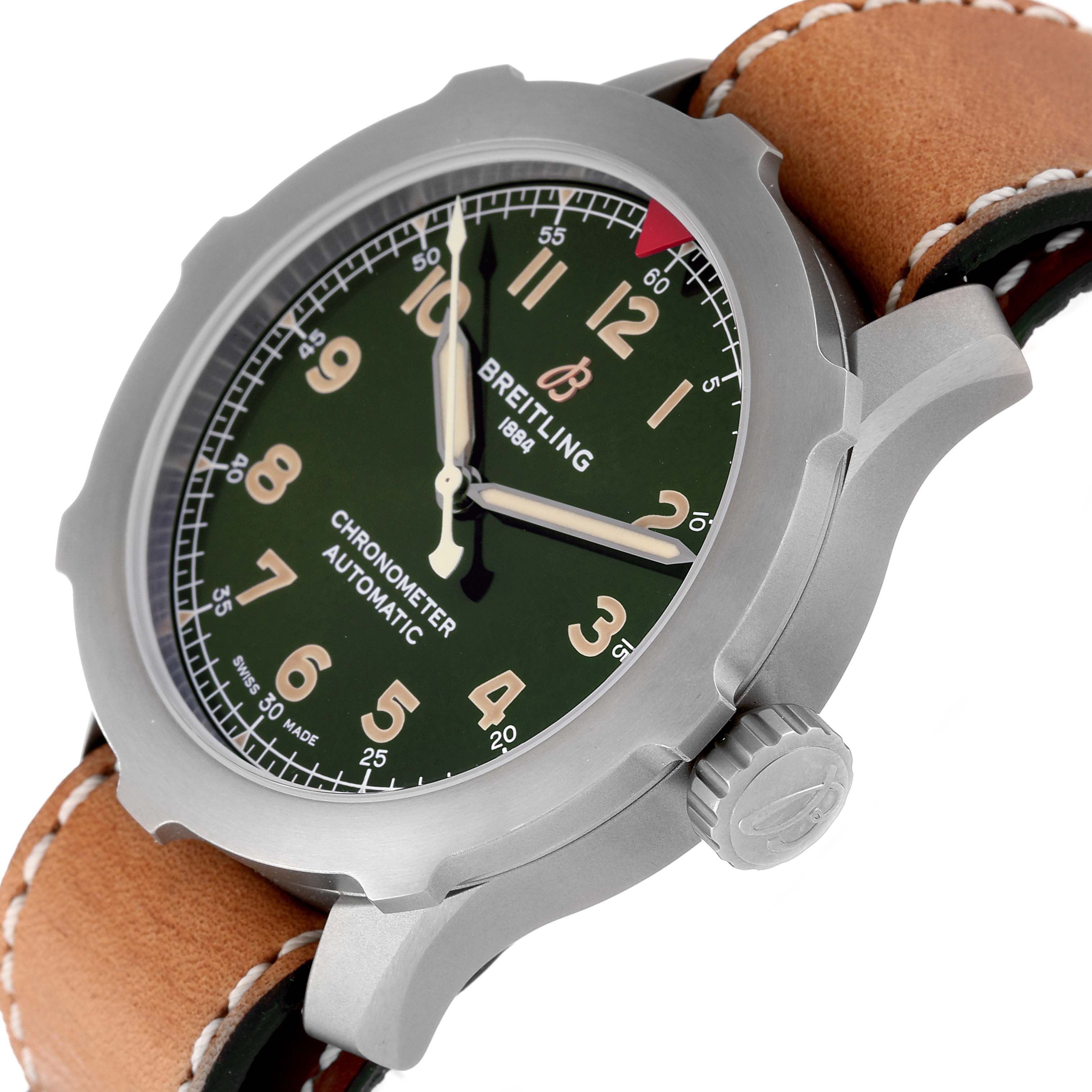 The image shows a side angle of a Breitling Navitimer watch, highlighting the dial, bezel, crown, and leather strap.