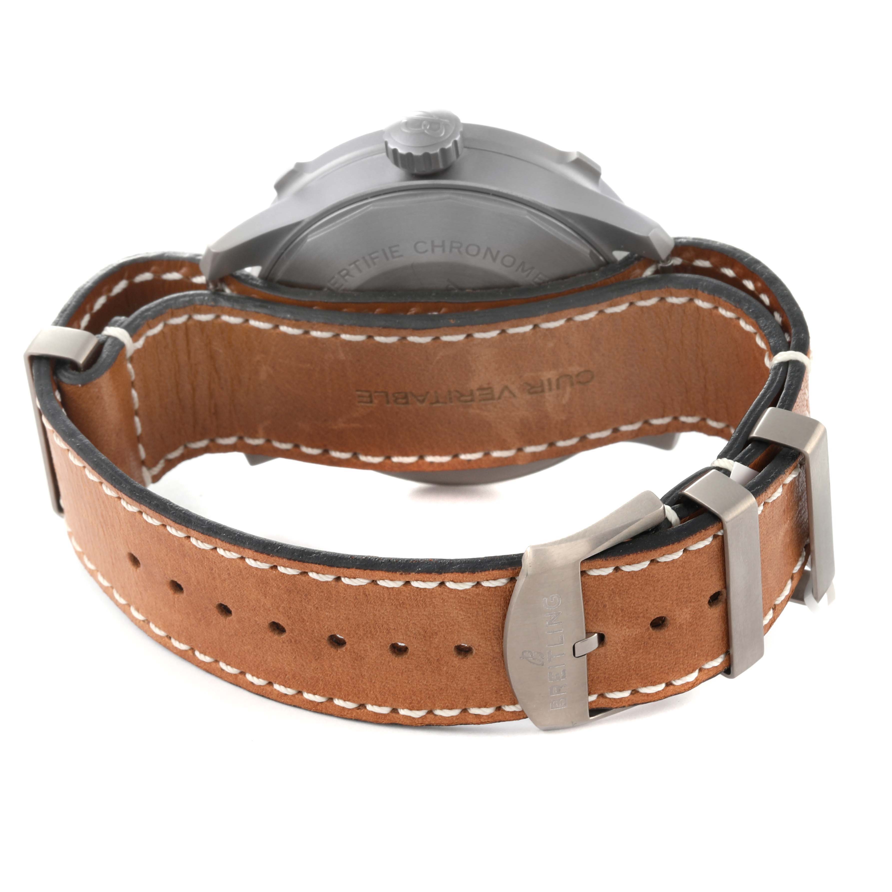 The image shows the back view of a Breitling Navitimer watch, highlighting its leather strap and buckle.