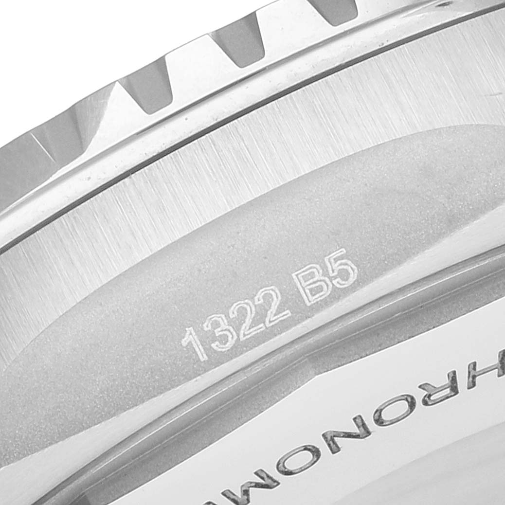 The image shows a close-up of the bezel and case back of a Breitling Superocean A17375 Men's Stainless Steel Blue Dial A17375 Men's Stainless Steel Blue Dial watch, highlighting the serial number engraved on it.