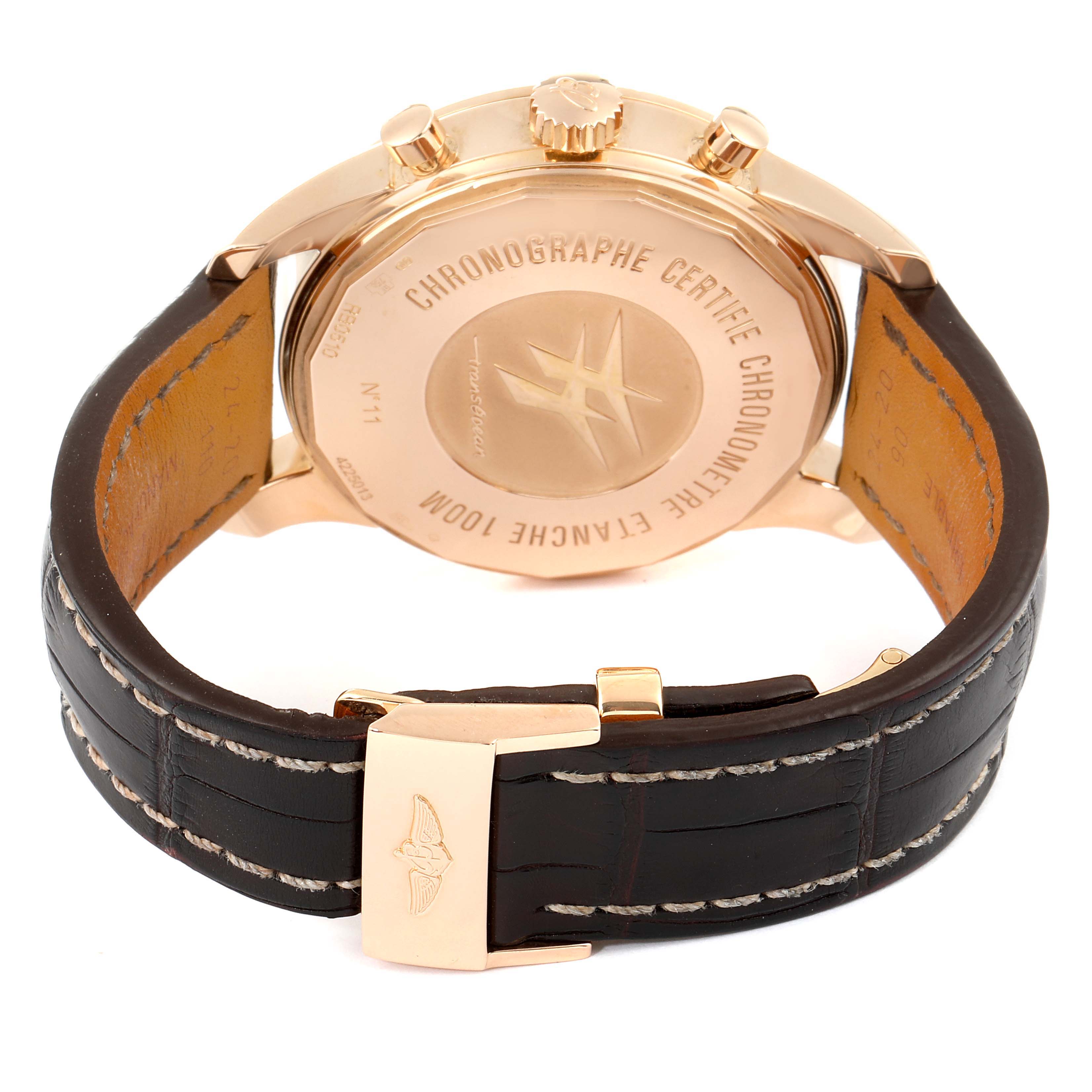 The image shows the back and strap of a Breitling Transocean RB0510 Men's Rose Gold Blue Dial RB0510 Men's Rose Gold Blue Dial watch, highlighting its case back and leather strap.