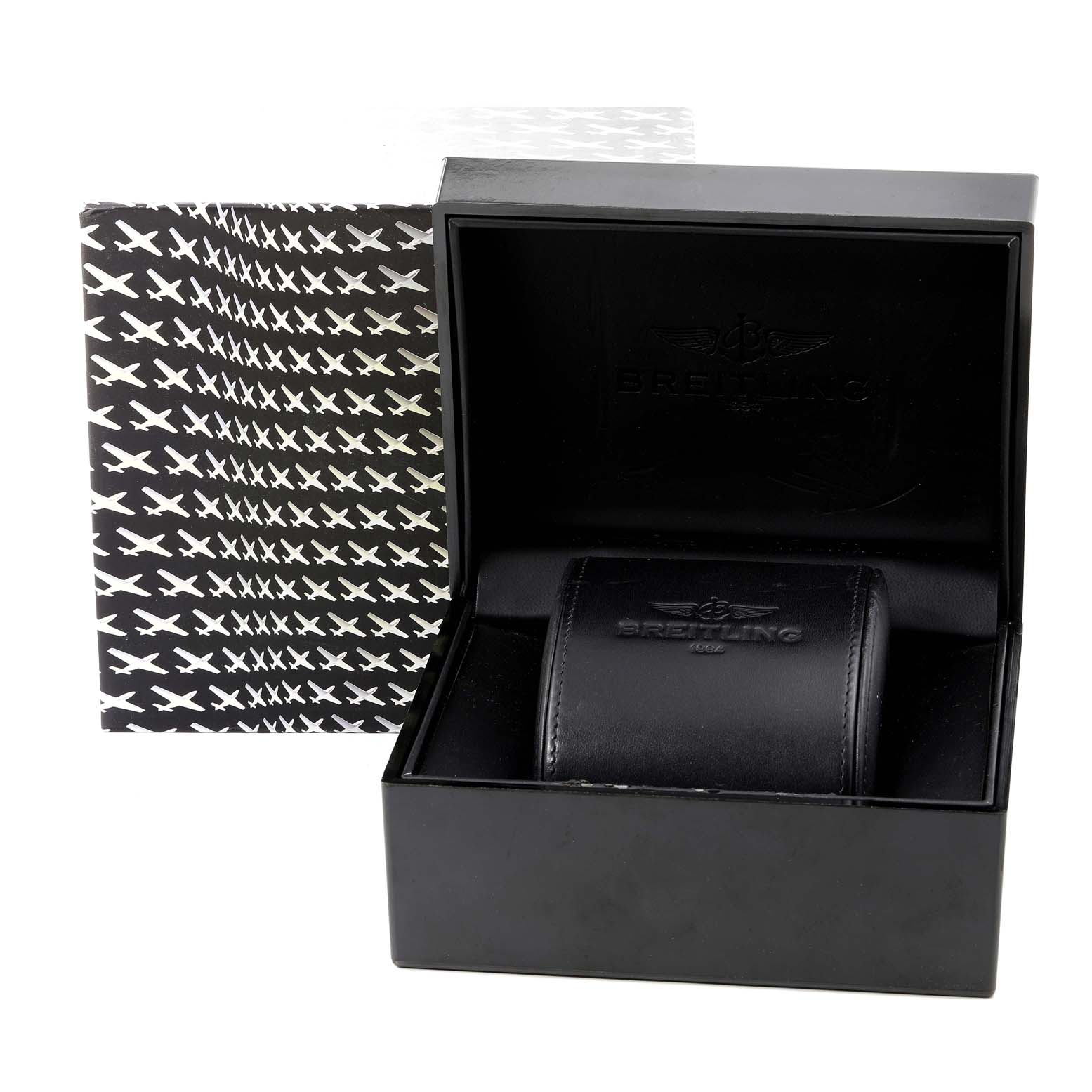 The image shows a Breitling Transocean RB0510 Men's Rose Gold Blue Dial RB0510 Men's Rose Gold Blue Dial watch box, with the watch inside its black leather case, and the cover partially open.