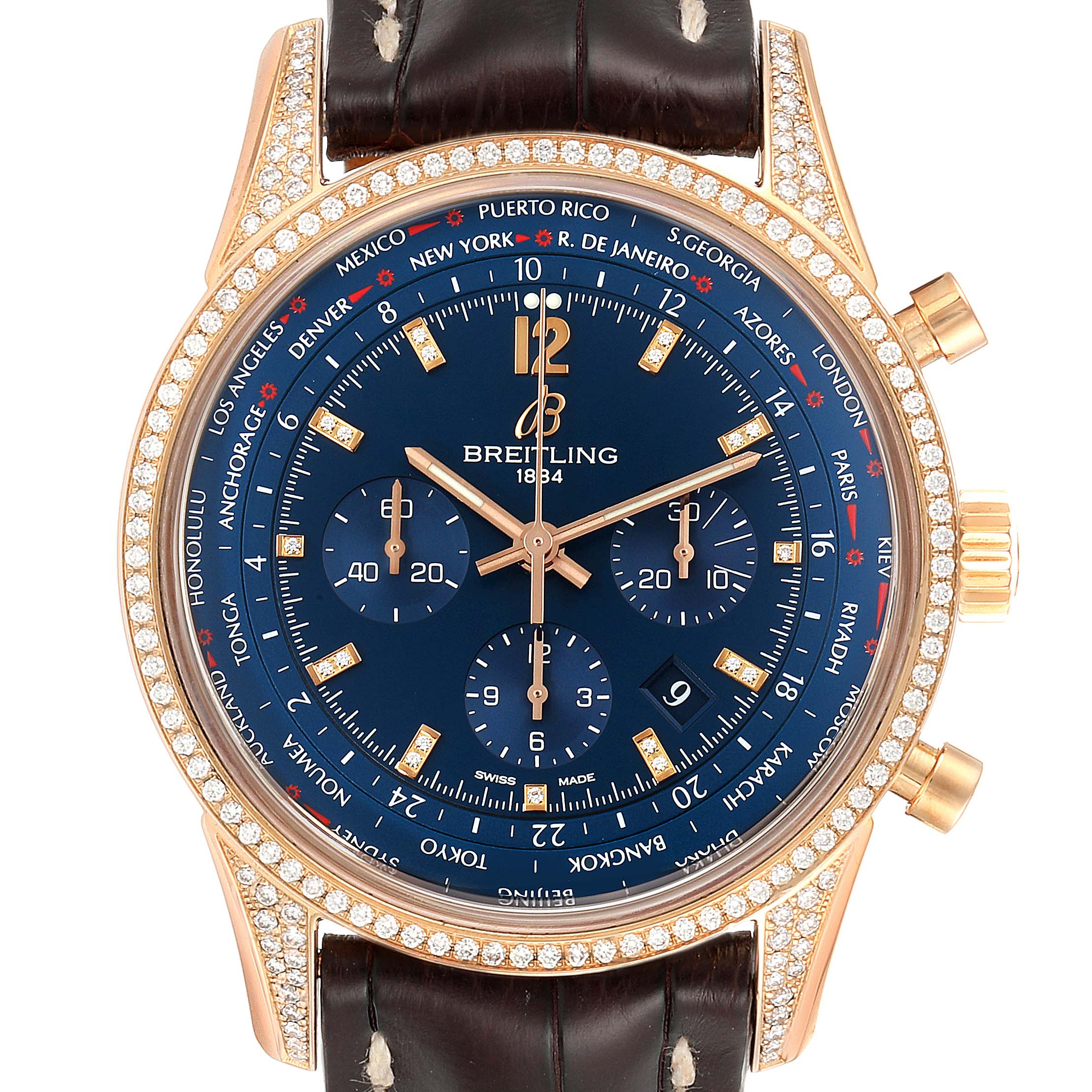 The Breitling Transocean RB0510 Men's Rose Gold Blue Dial RB0510 Men's Rose Gold Blue Dial watch is shown from the front, featuring a blue dial, gold bezel with diamonds, and a brown leather strap.