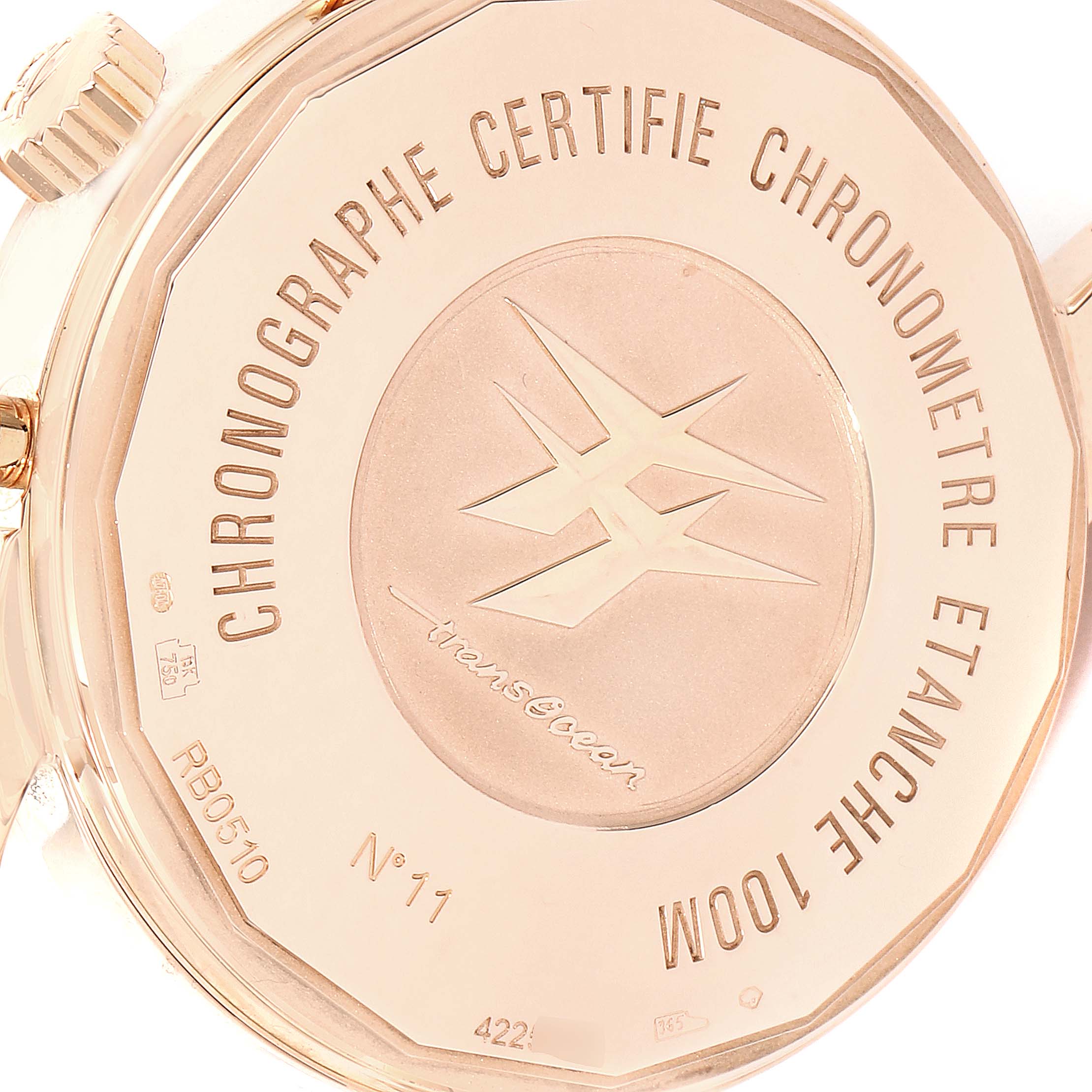 The image shows the case back of a Breitling Transocean RB0510 Men's Rose Gold Blue Dial RB0510 Men's Rose Gold Blue Dial watch, featuring inscriptions and the model name.