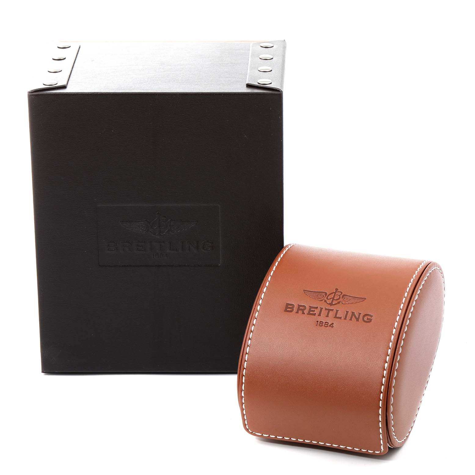 The image shows a Breitling Transocean AB0510 Men's Stainless Steel Silver Dial AB0510 Men's Stainless Steel Silver Dial watch box and a brown leather travel case with the Breitling logo.