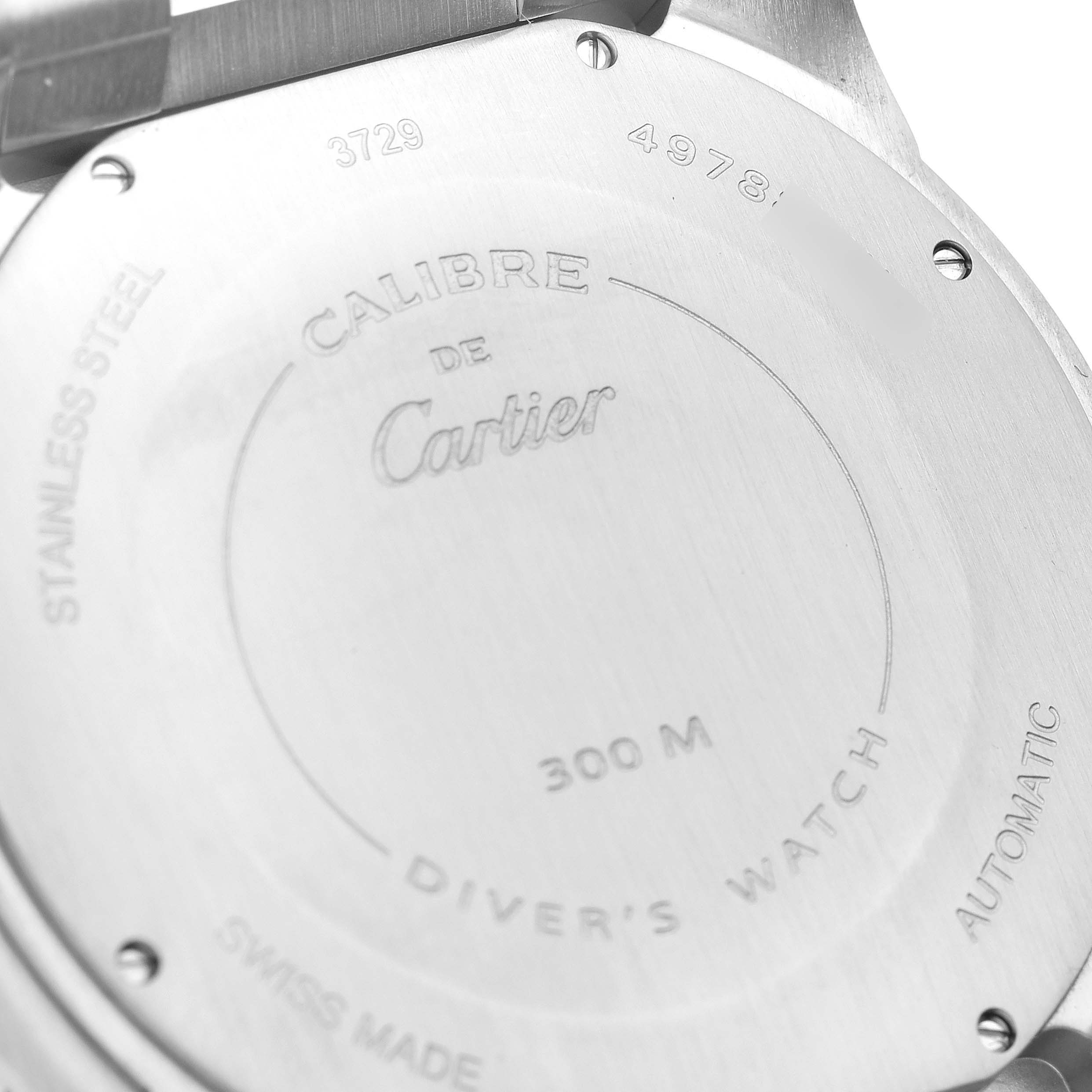 The image shows the stainless steel case back of a Calibre de Cartier Diver
s Watch by Cartier.