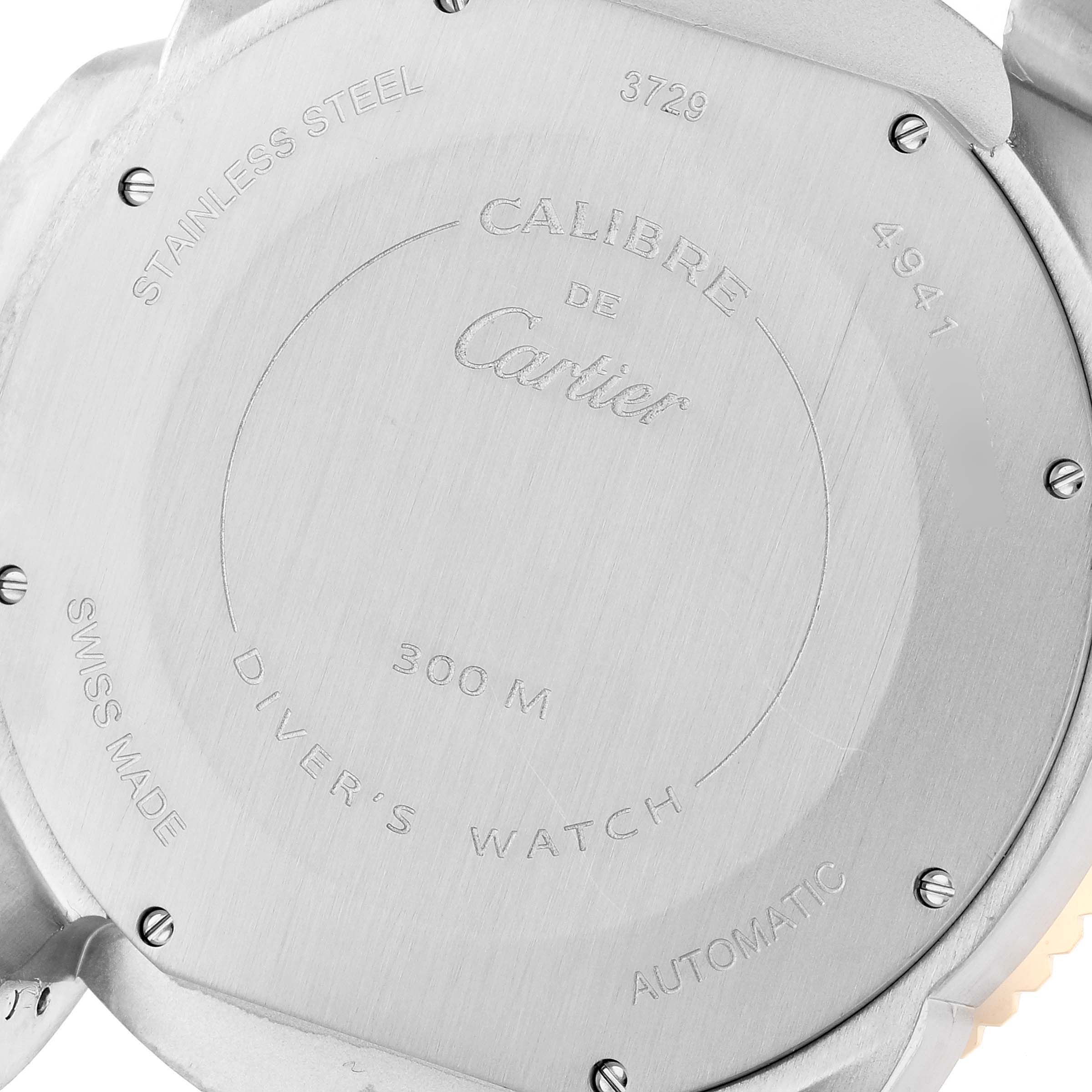 This image shows the back casing of a Calibre de Cartier watch by Cartier, highlighting its stainless steel material and other specifications.