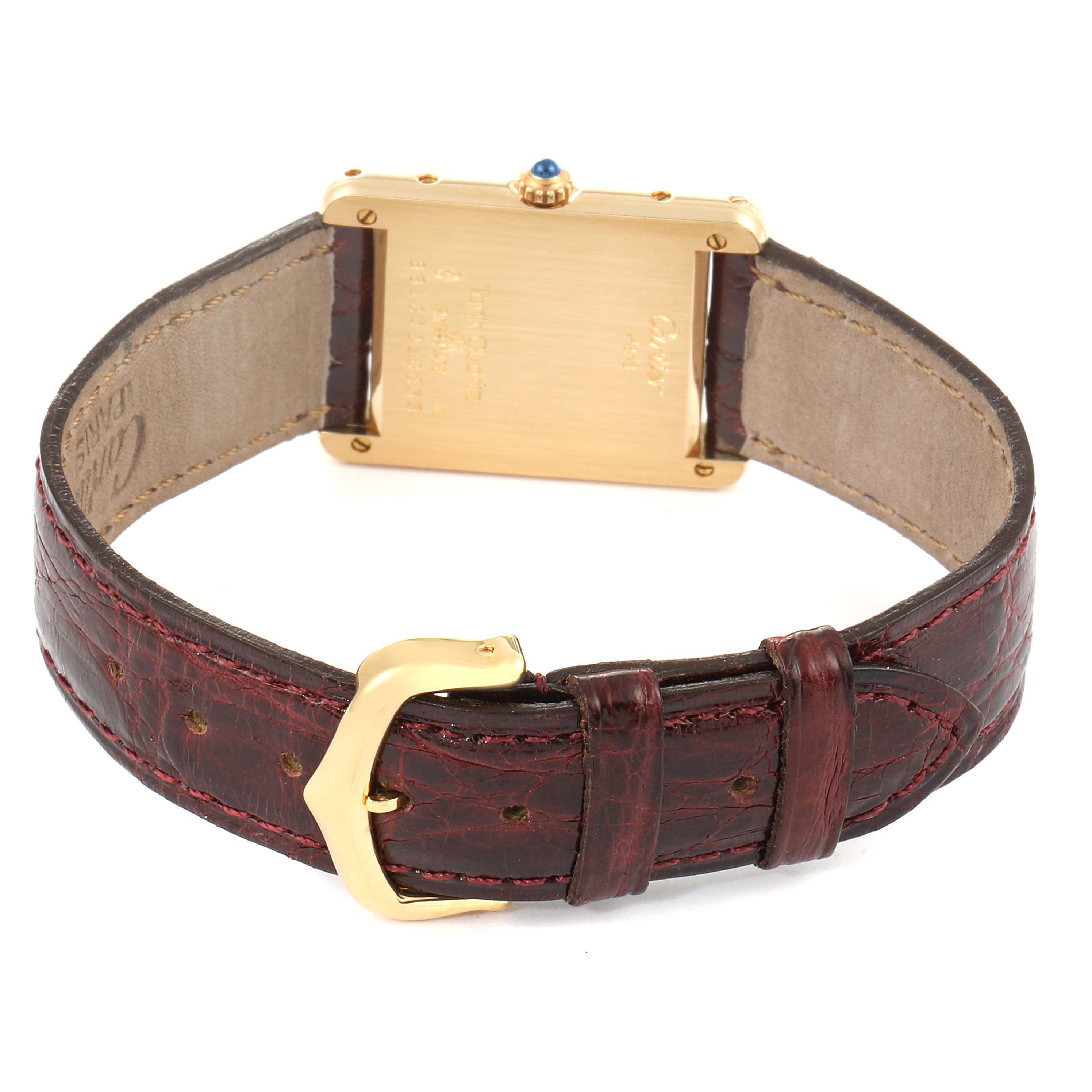 This image shows the back of a Cartier Tank Classic  Women's Yellow Gold White Dial  Women's Yellow Gold White Dial watch, highlighting the gold case, crown, and brown leather strap with buckle.