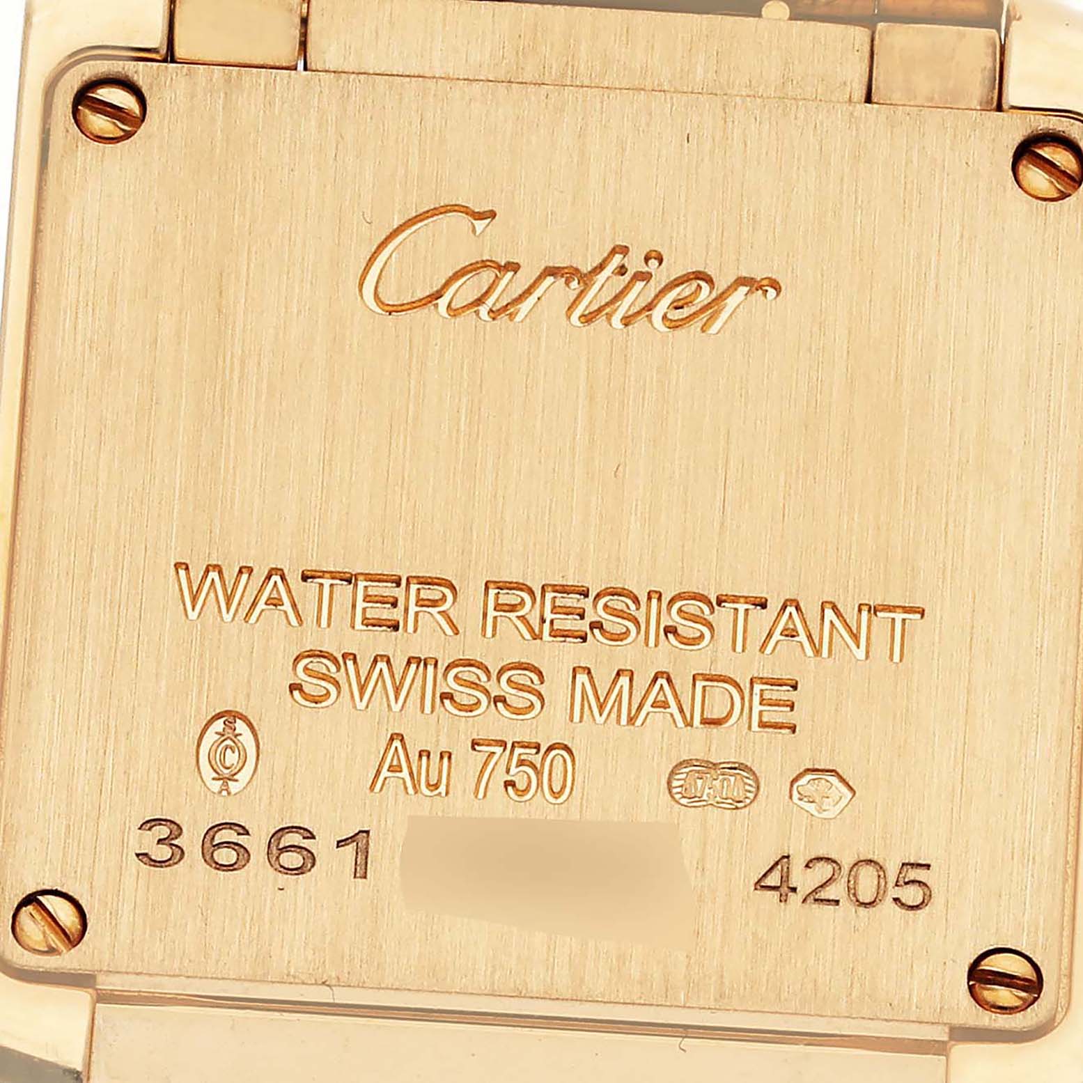 This image shows the back of a Cartier Tank Française watch, featuring engravings and screws.