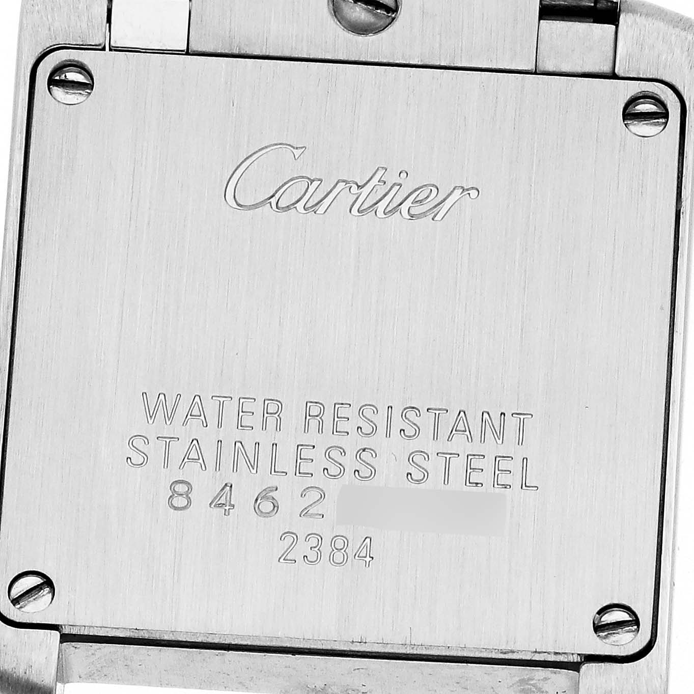The image shows the back case of a Cartier Tank Française watch, highlighting its water-resistant and stainless steel details.