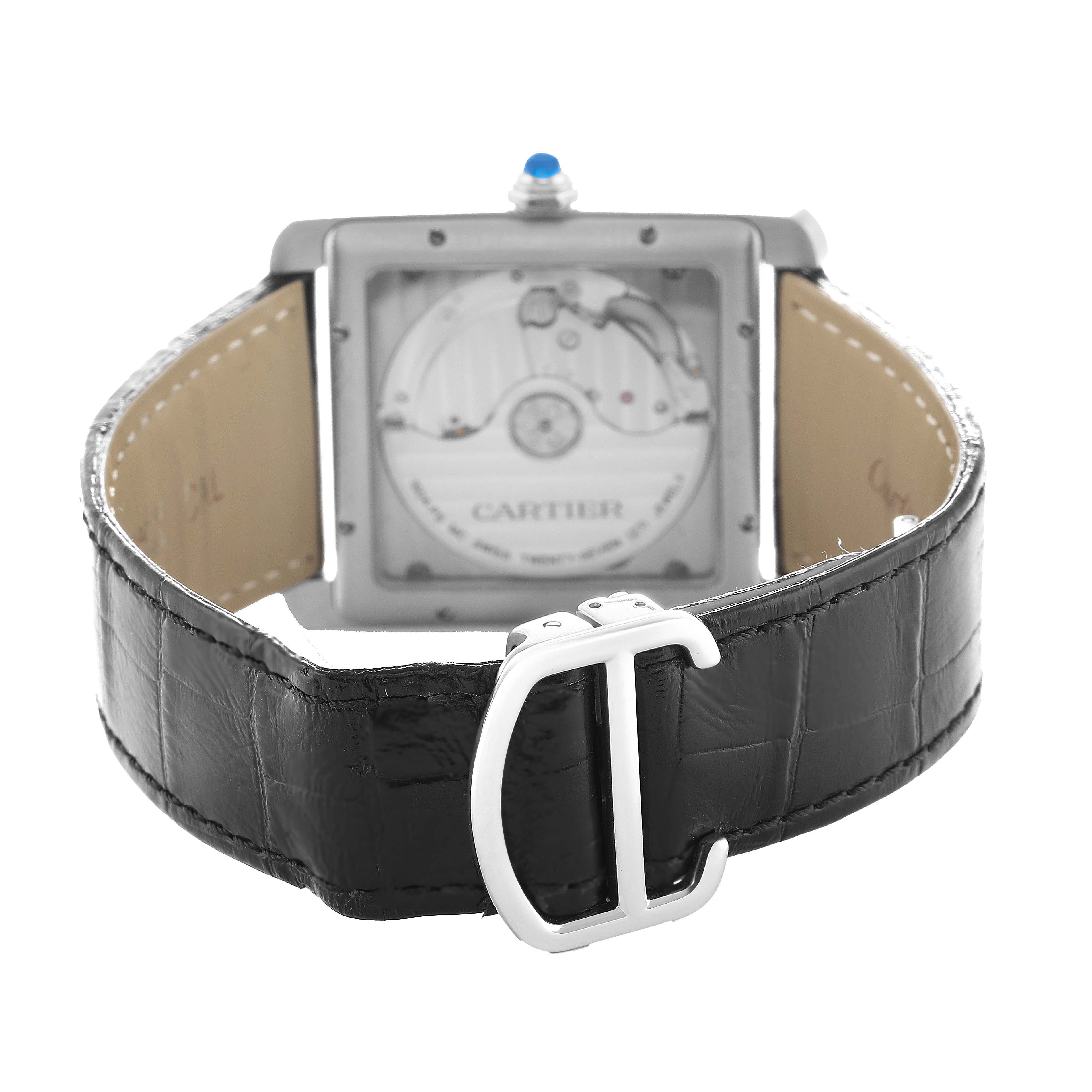 The Cartier Tank MC W5330003 Men's Stainless Steel Silver Dial watch is shown from the back, displaying the movement and the black leather strap with a metal clasp.