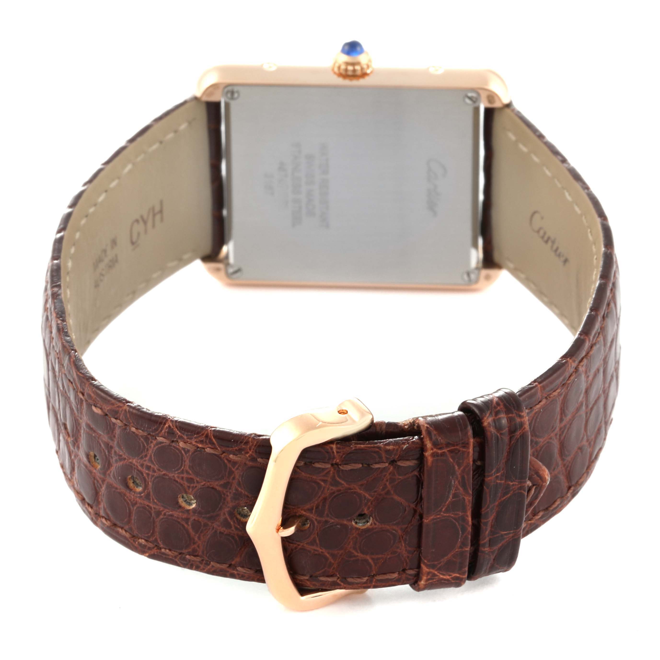 The image shows the back of the Cartier Tank Solo W5200025 Men
s Steel and Gold (two tone) Silver Dial W5200025 Men
s Steel and Gold (two tone) Silver Dial watch, highlighting its brown leather strap and gold buckle.