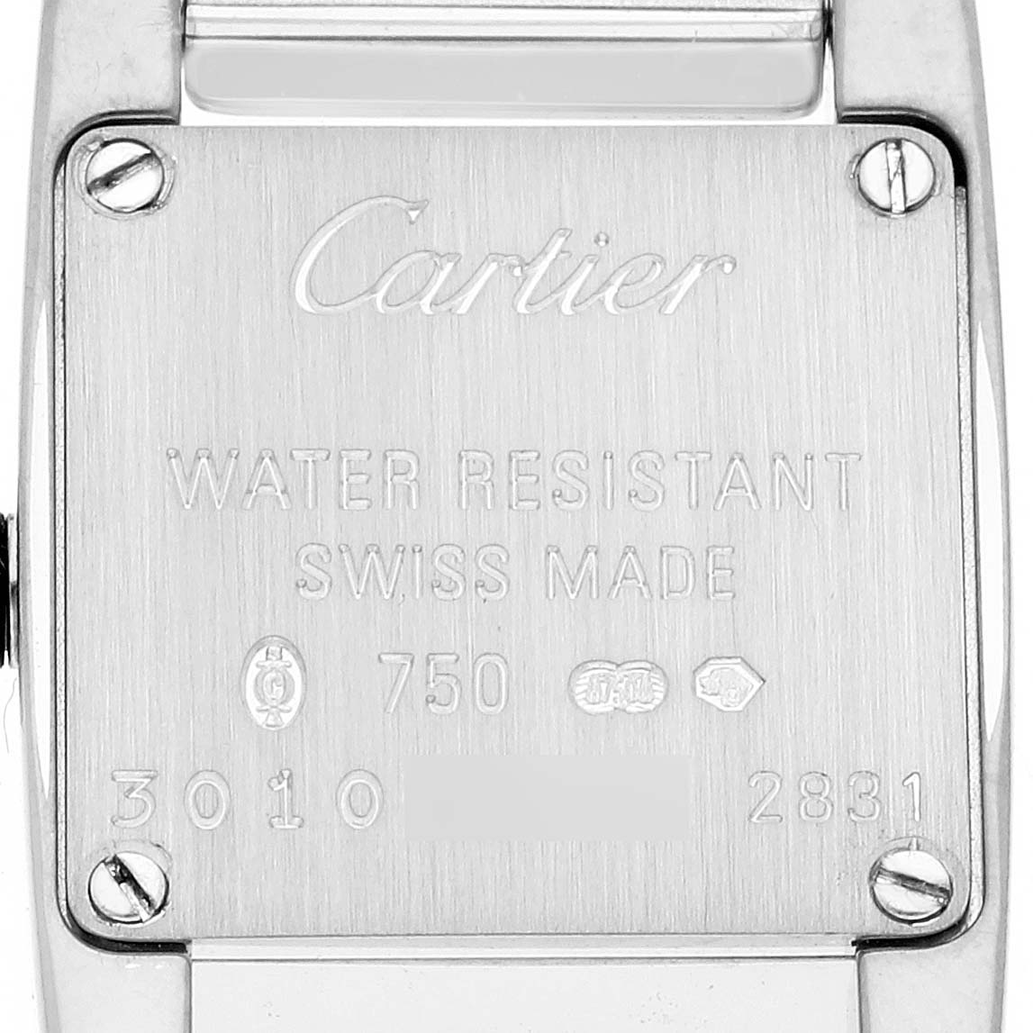 This image shows the case back of a Tankissime model by Cartier, displaying engravings and screws.