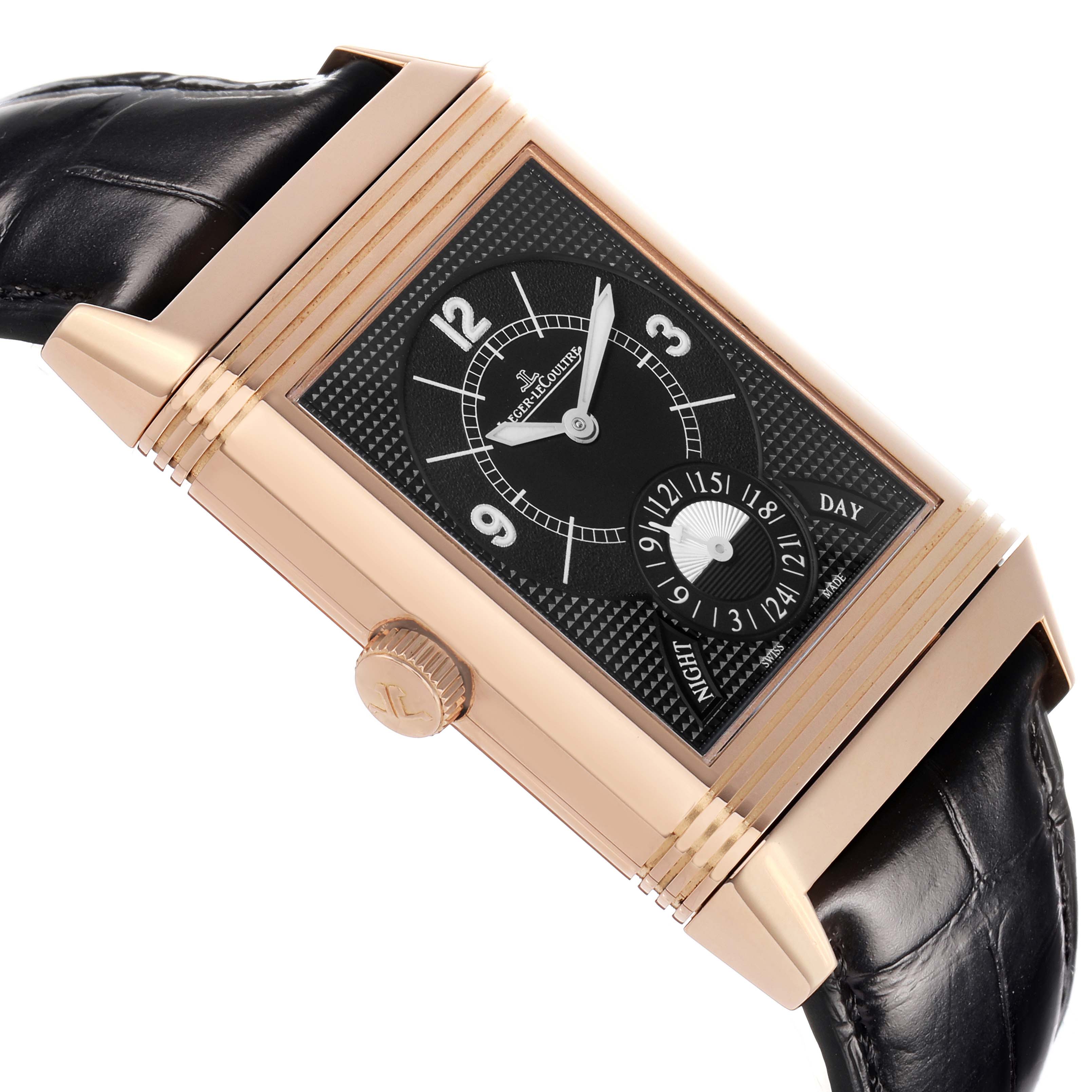 The Jaeger-LeCoultre Reverso model is shown at an angle highlighting its black dial, gold case, crown, and leather strap.