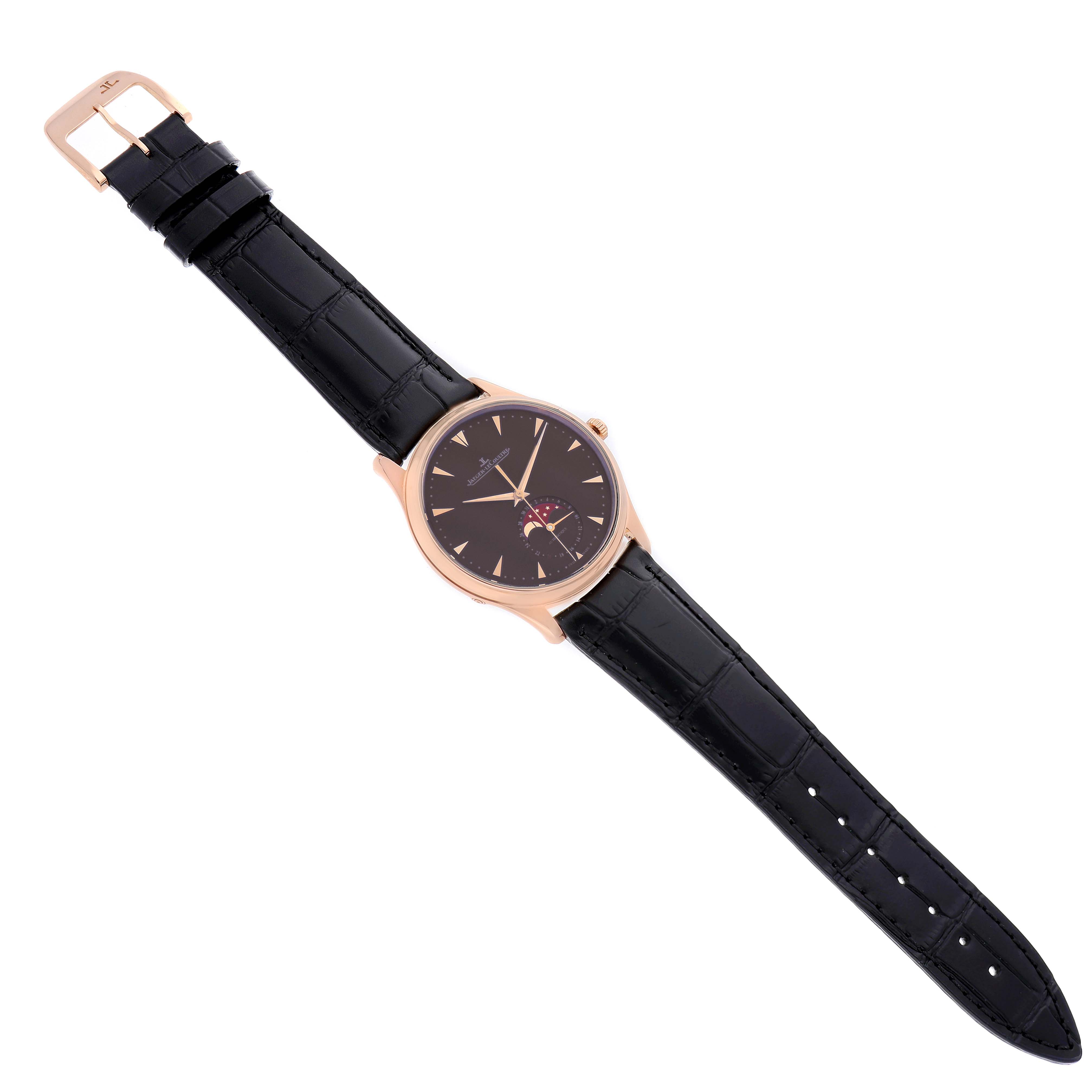 The Jaeger LeCoultre Master Q136256C Men's Rose Gold Brown Dial watch is shown from a top-down angle, displaying the black dial, rose gold case, and black strap.