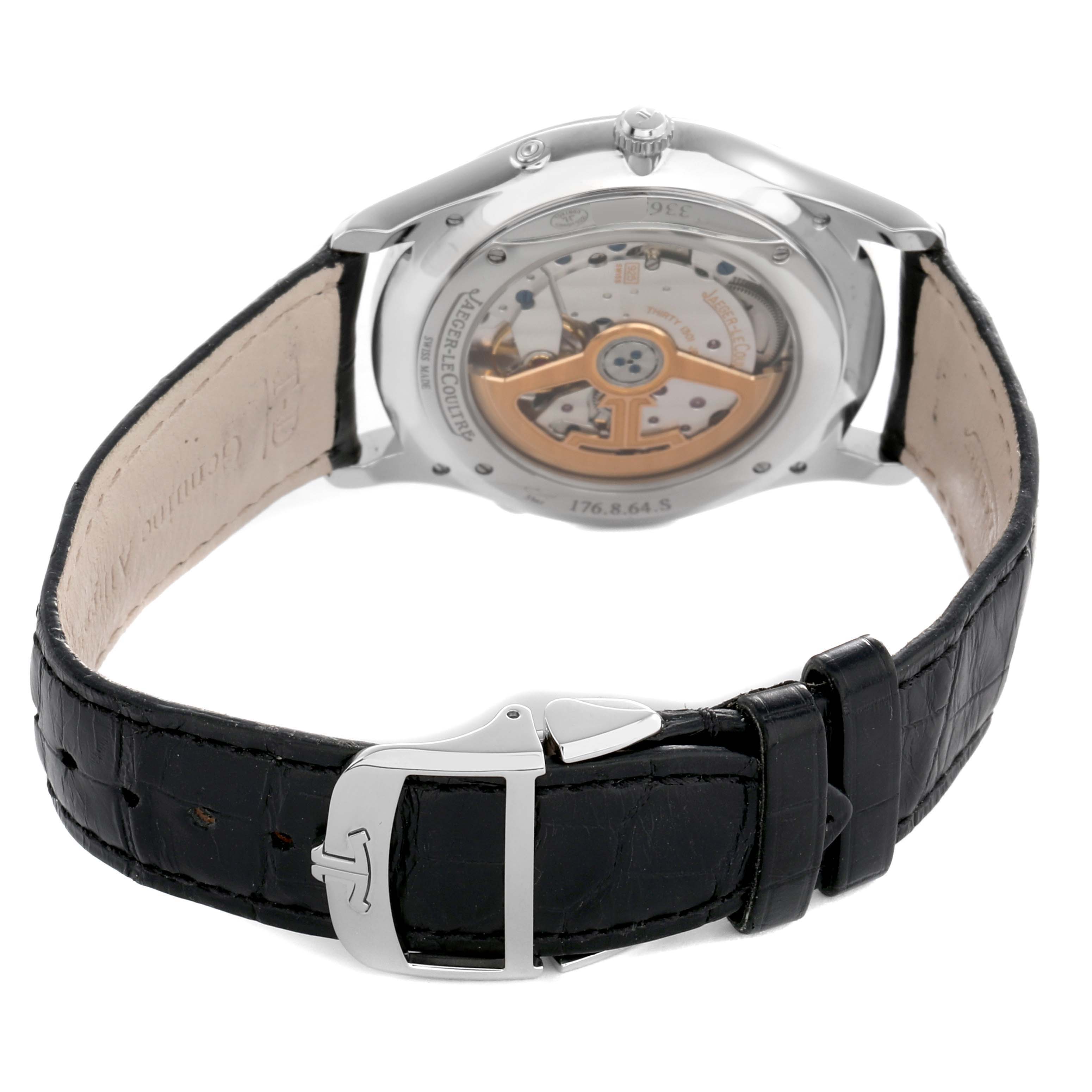 The image shows the back view of a Jaeger LeCoultre Master Q1368470 Men's Stainless Steel Black Dial watch, highlighting the movement and black leather strap with a clasp.