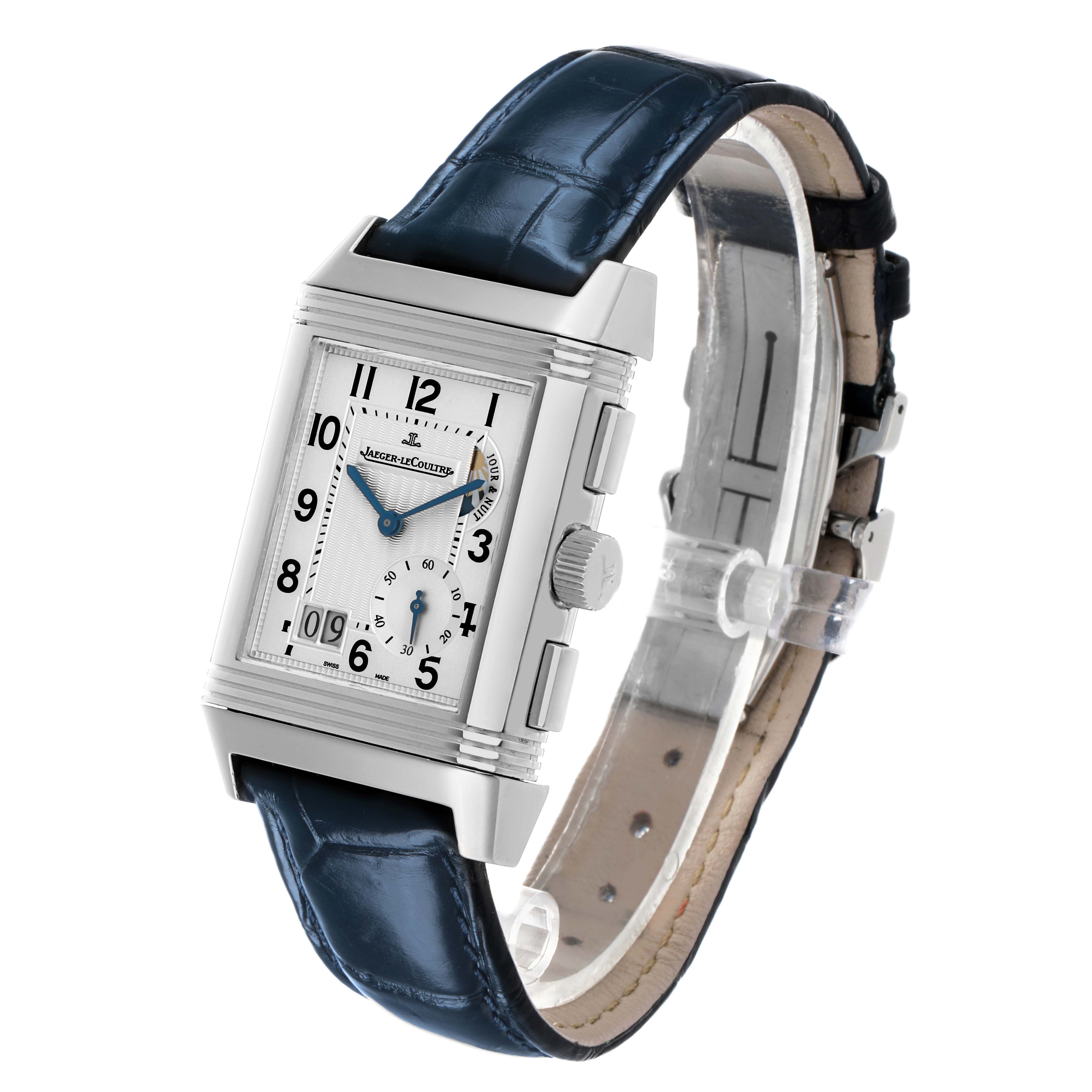 The Jaeger-LeCoultre Reverso watch is shown at a slight angle, highlighting the dial, side buttons, crown, and leather strap.