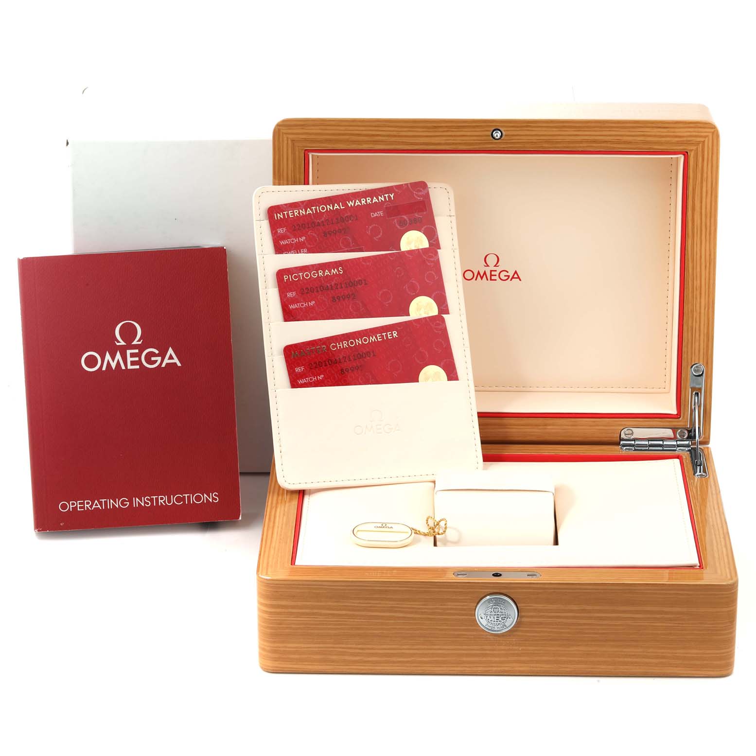 The image shows the Omega Aqua Terra 220.10.41.21.10.001 Men's Stainless Steel Green Dial 220.10.41.21.10.001 Men's Stainless Steel Green Dial watch box, warranty cards, operating instructions, and accessories from a top-front angle.