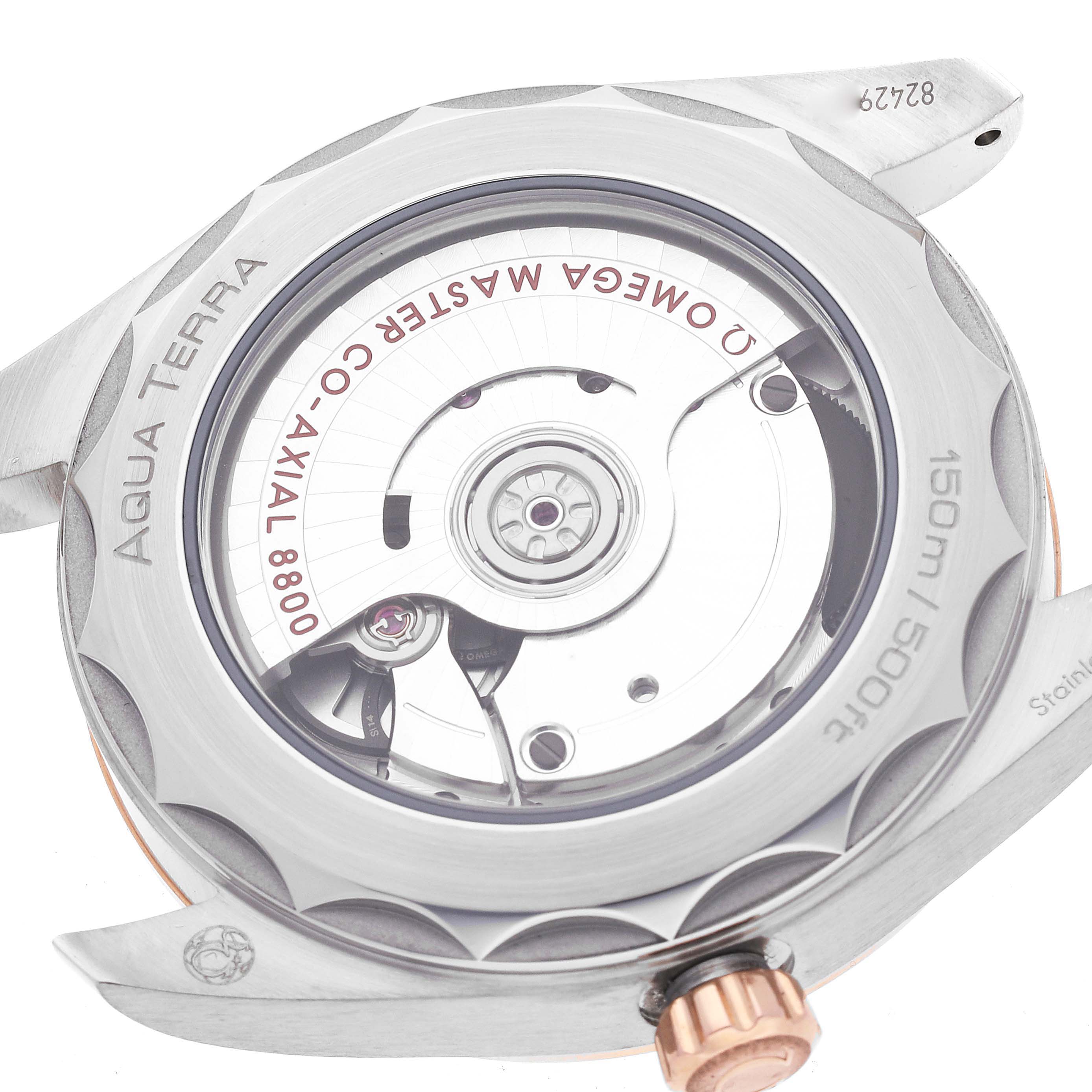 The image shows the back of an Omega Aqua Terra 220.20.38.20.06.001 Men's Steel and Gold (two tone) Grey Dial 220.20.38.20.06.001 Men's Steel and Gold (two tone) Grey Dial watch, highlighting its movement and case back details.