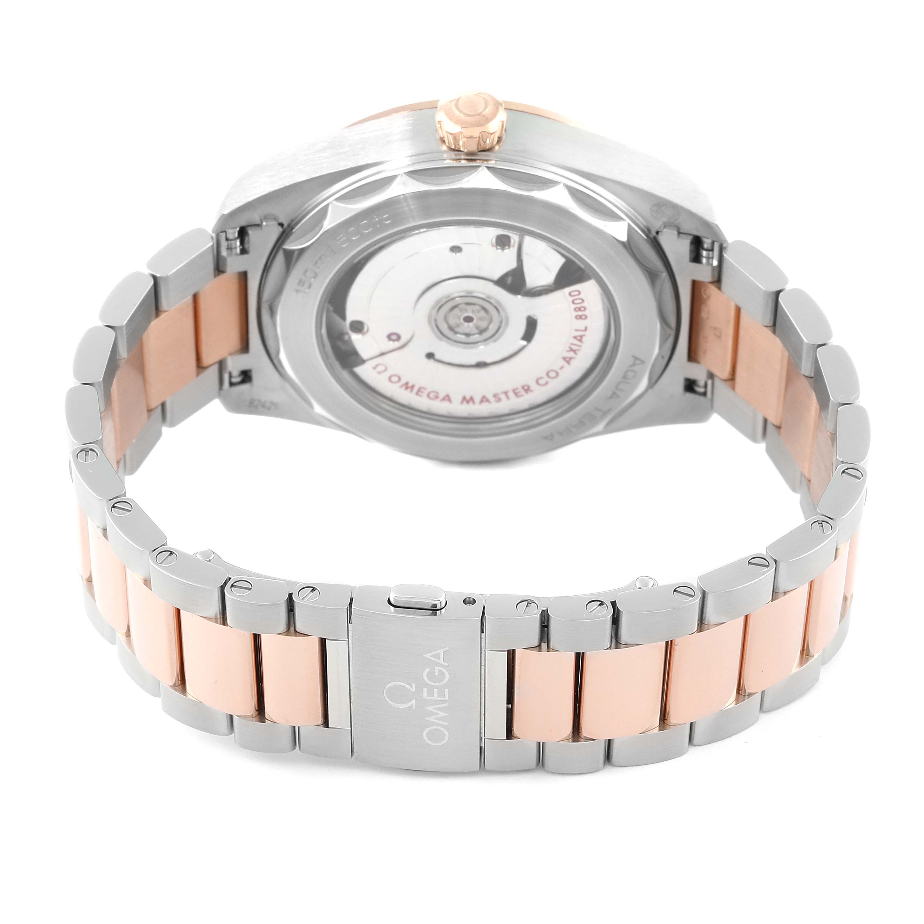 The image shows the back view of an Omega Aqua Terra 220.20.38.20.06.001 Men's Steel and Gold (two tone) Grey Dial 220.20.38.20.06.001 Men's Steel and Gold (two tone) Grey Dial watch, highlighting its clasp, bracelet, and transparent case back.