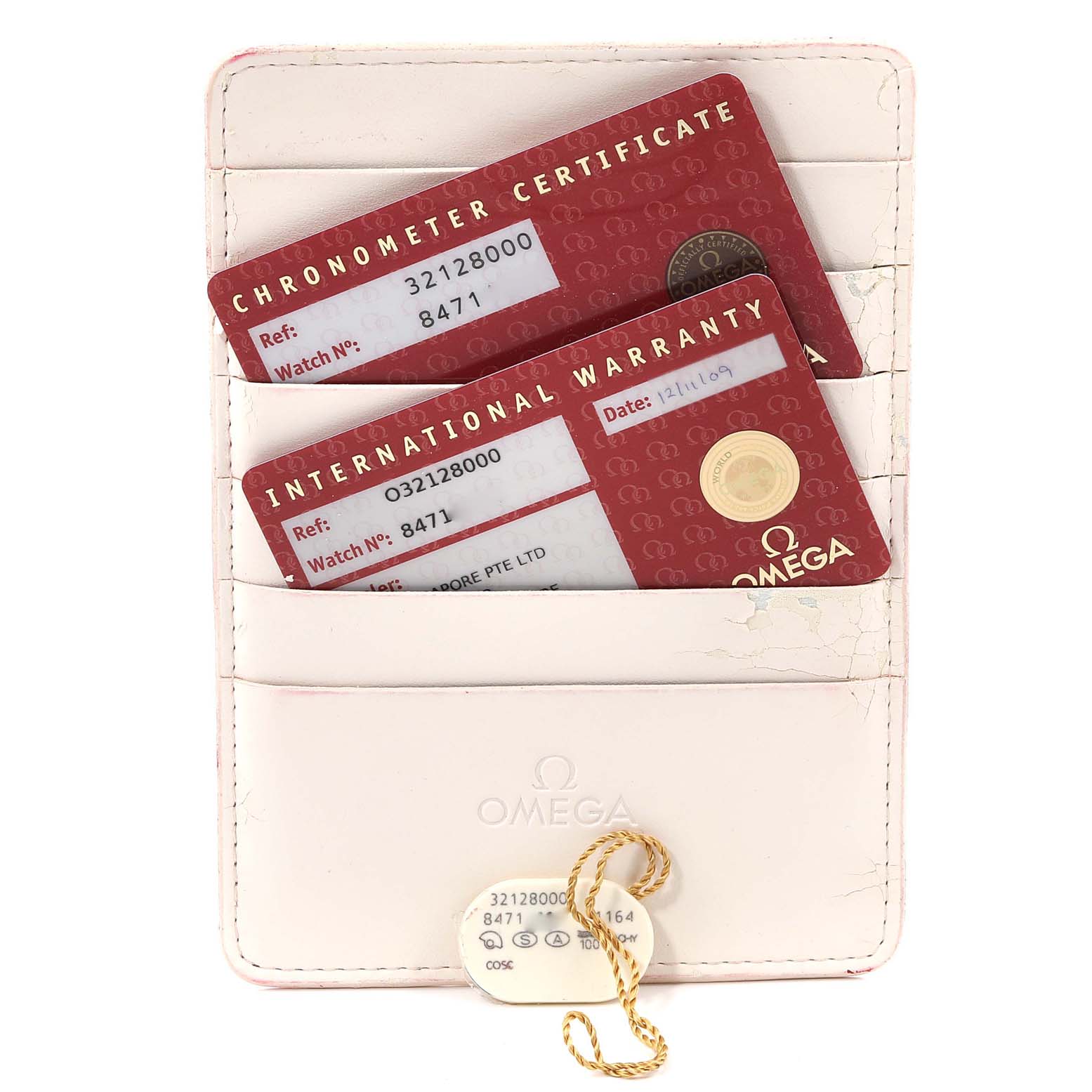 The image shows the warranty and chronometer certificate cards in a holder for an Omega Speedmaster 3212.80.00 Men
s Stainless Steel Blue Dial 3212.80.00 Men
s Stainless Steel Blue Dial watch.